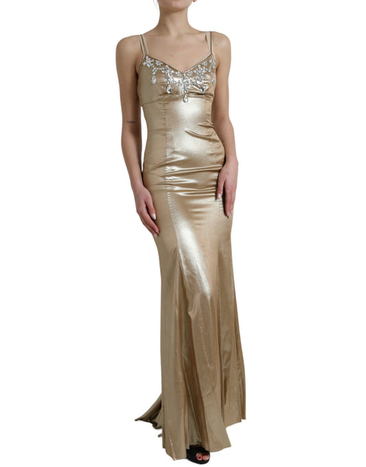 A long, shiny gold dress with crystal embellishments