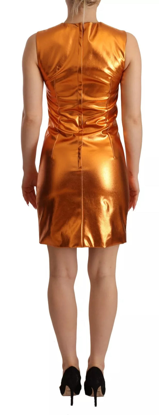 A sleeveless sheath dress in metallic orange color, designed by Dolce & Gabbana