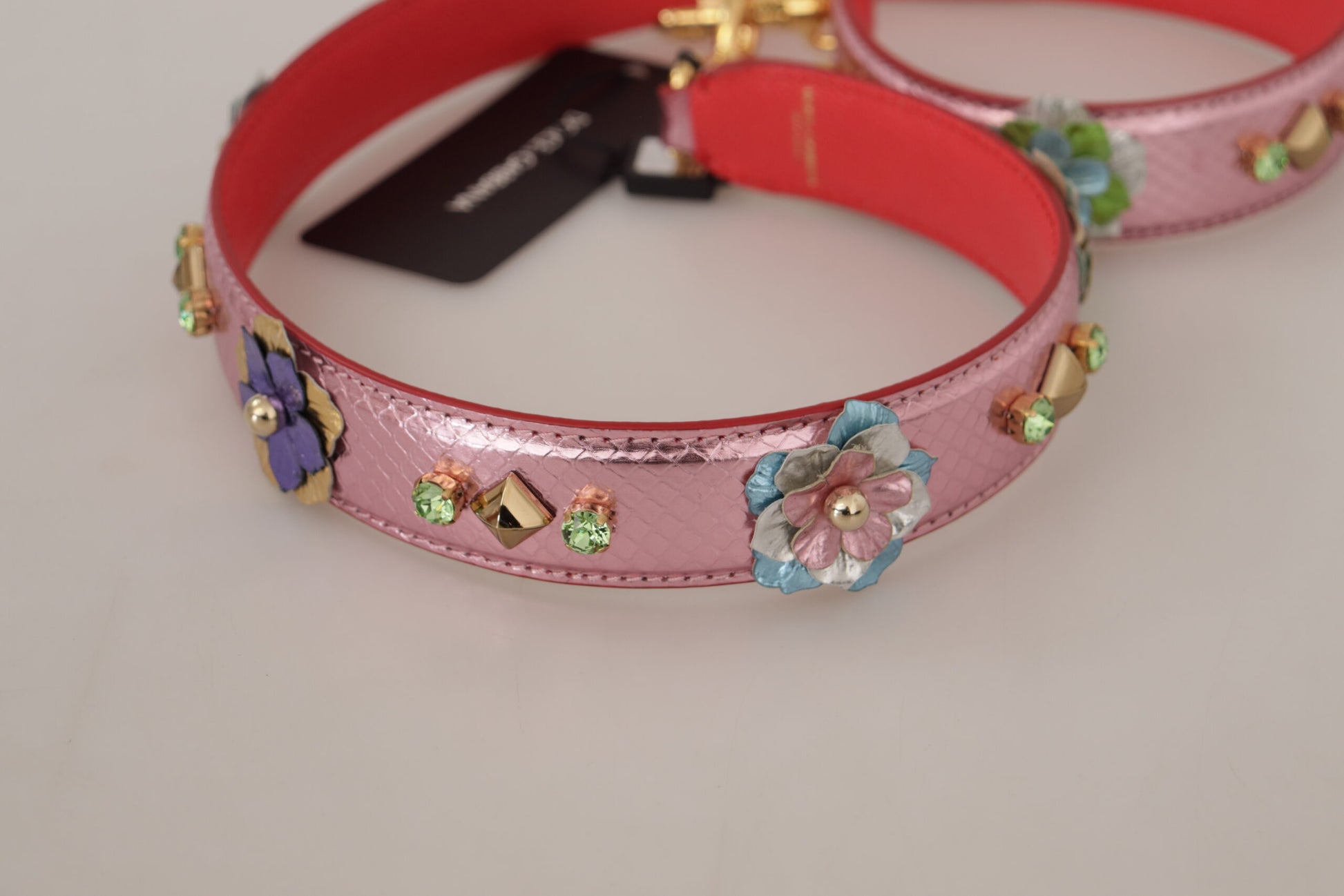 Pink bracelet with floral embroidery and rhinestones