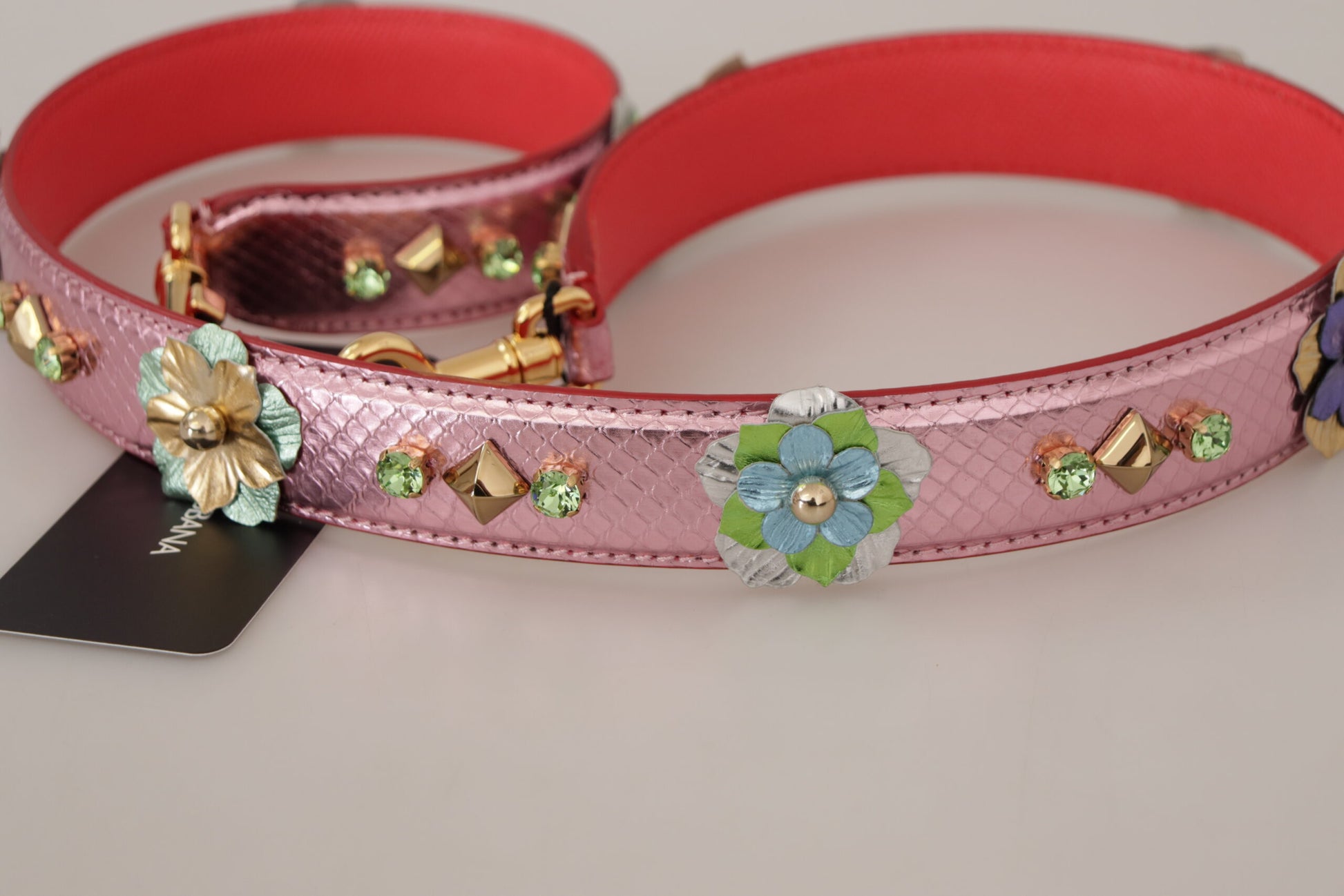 Decorative pink hair band with floral embellishments
