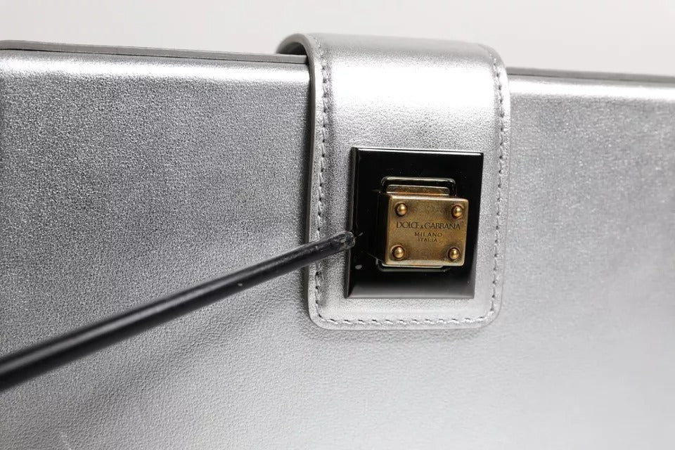 Silver metal guitar case with black handle