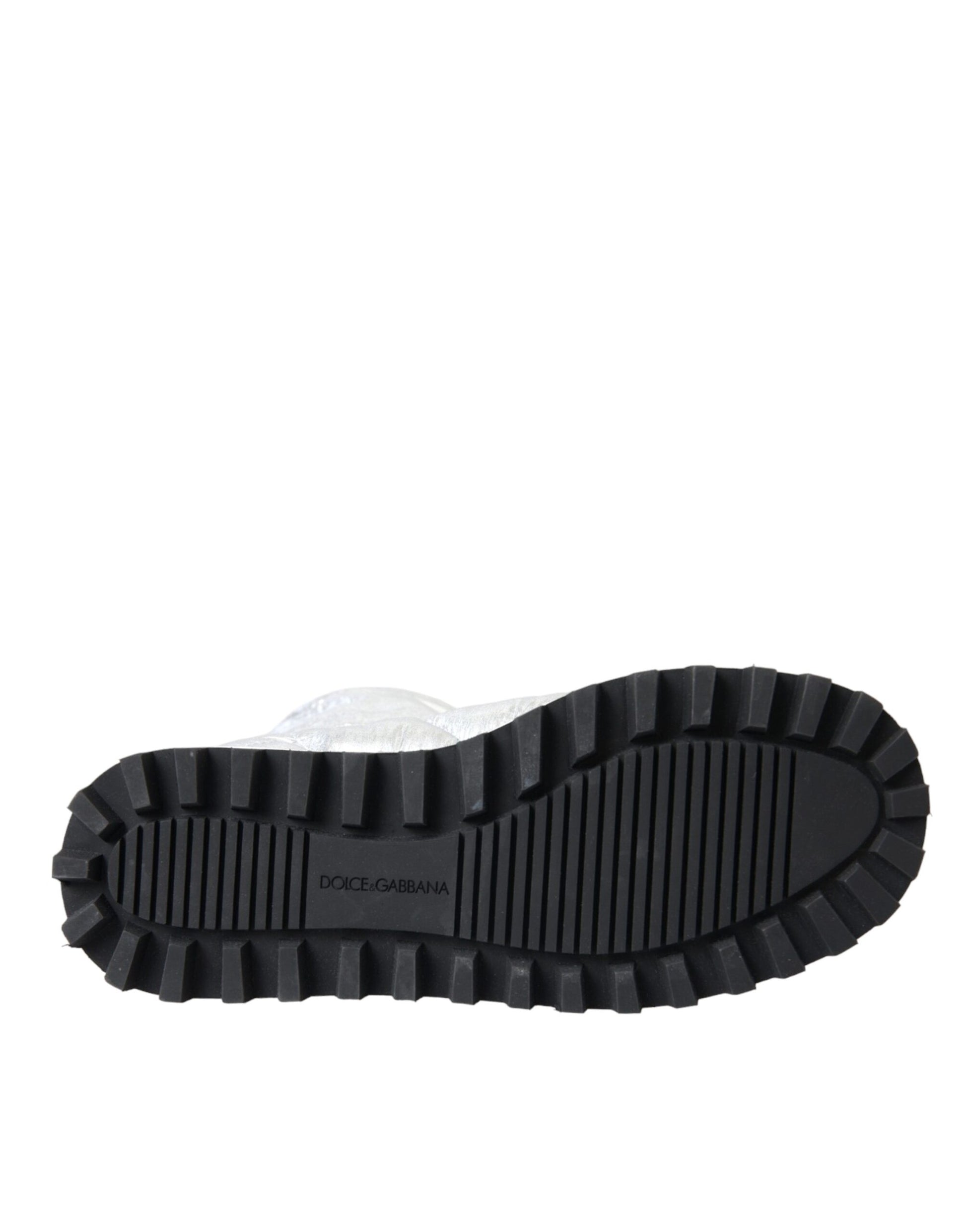 Black rubber boot with deep treads for outdoor use