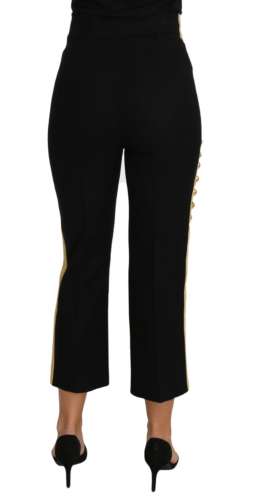 Pair of black pants with gold zipper detailing