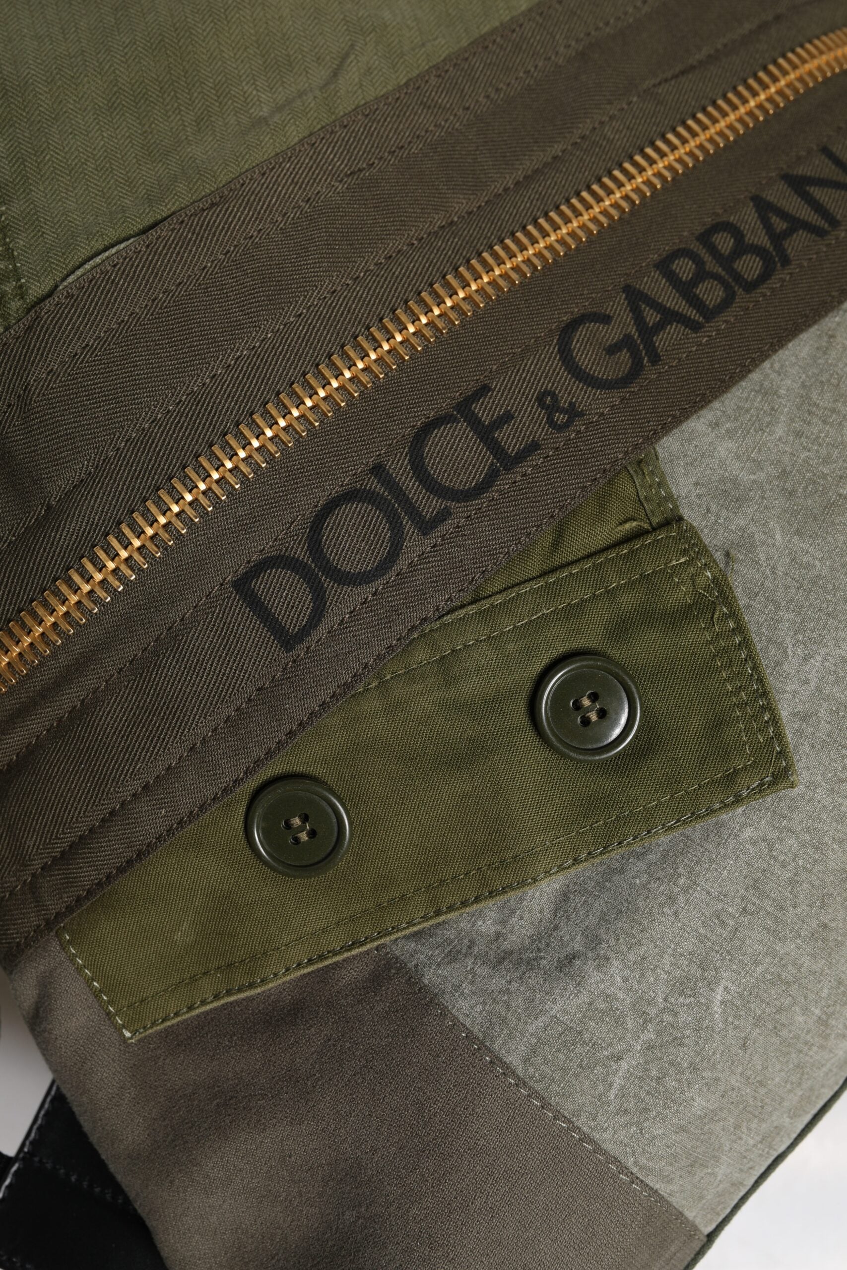 Green camouflage jacket with zippered pockets and buttons