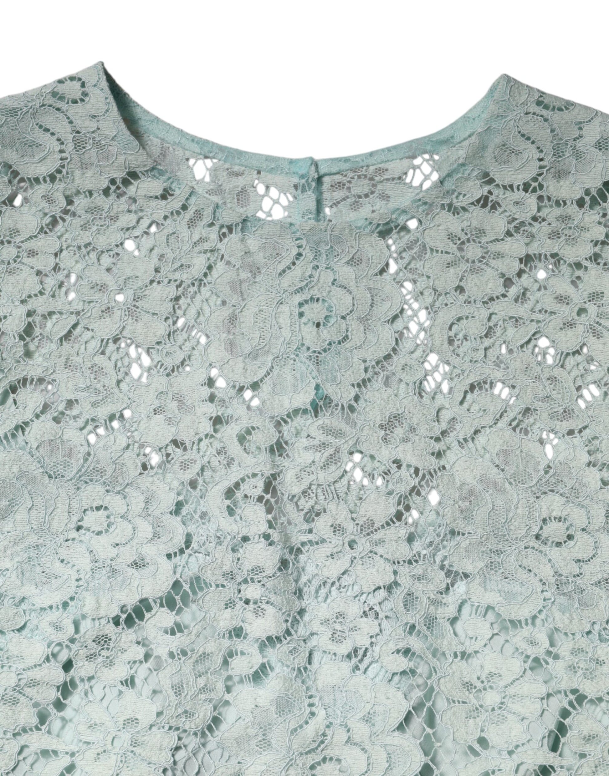 Lace top with embroidered design on neckline