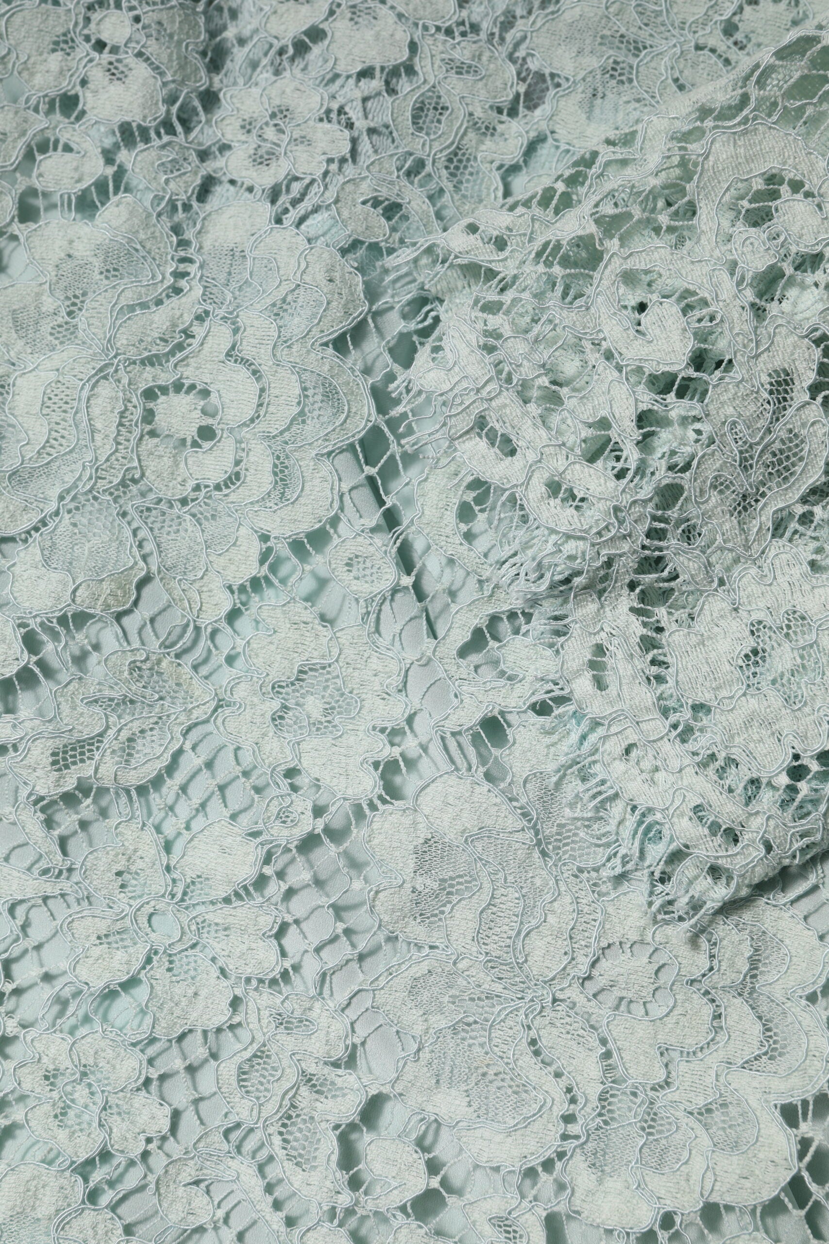 White lace fabric with intricate patterns