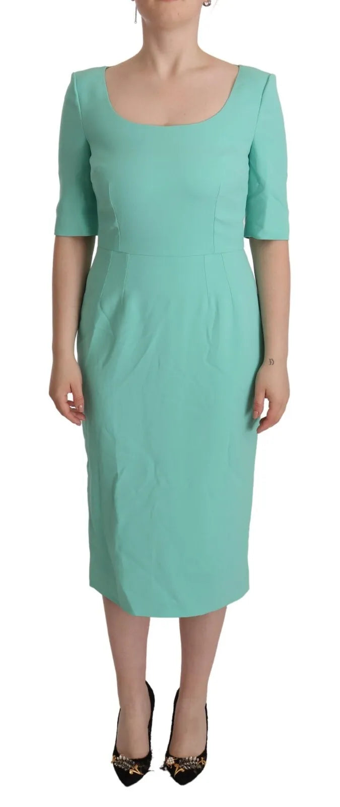 A mint green sheath dress with a square neckline and midi length, designed by Dolce & Gabbana