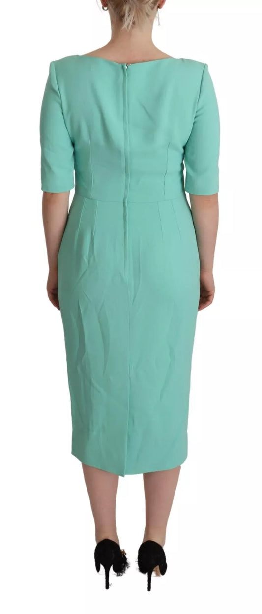 A mint green sheath dress with a square neckline and midi length, designed by Dolce & Gabbana