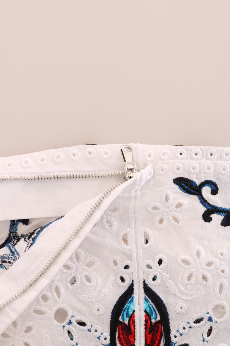 White lace dress with blue embroidery on front