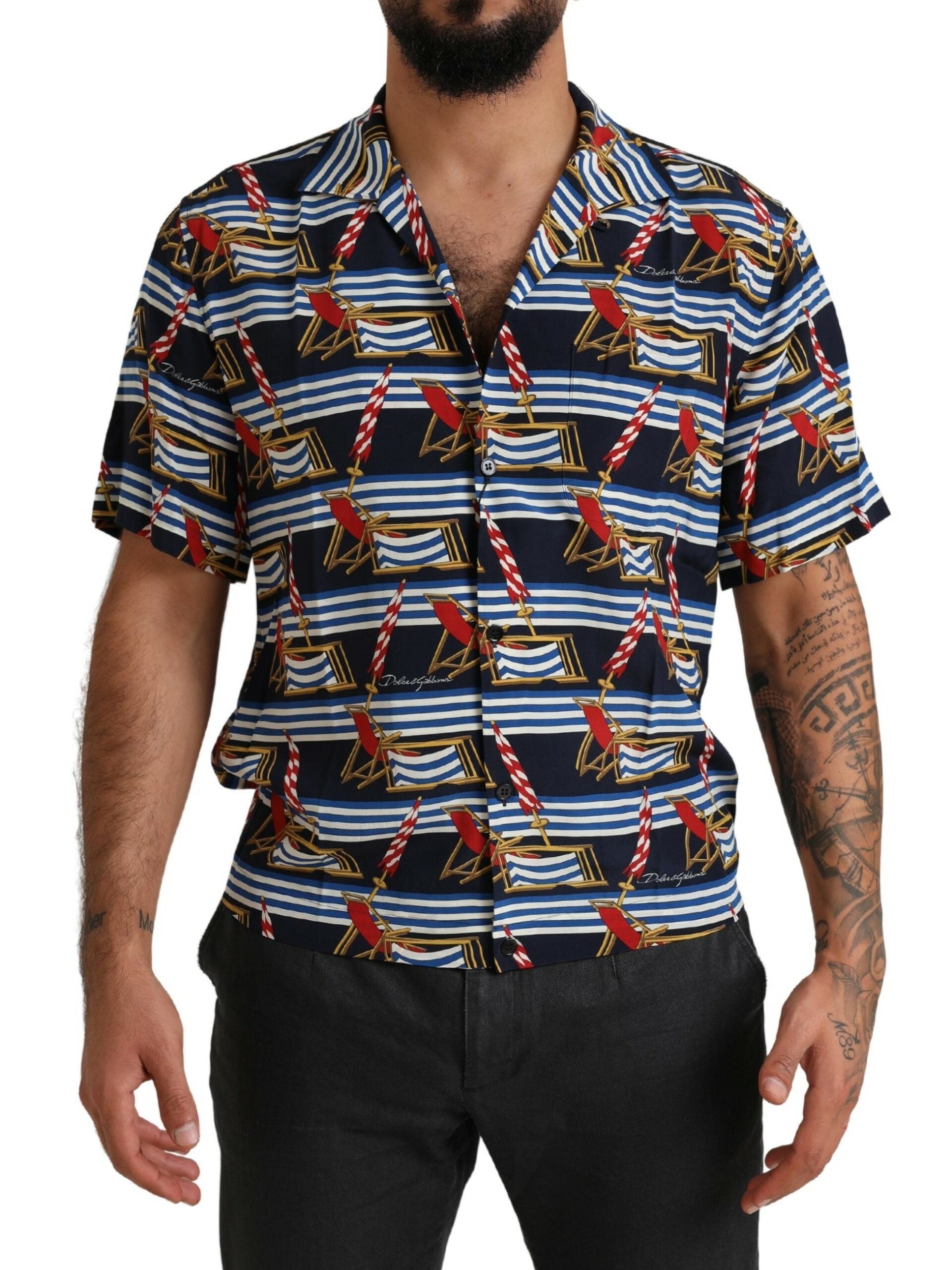 Man wearing a short sleeve shirt with blue and red pattern