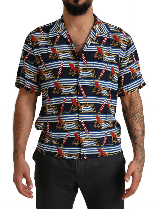 Man wearing a short sleeve shirt with blue and red pattern