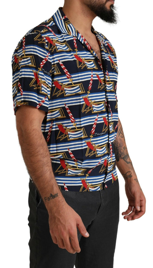 Man wearing a short sleeve shirt with a nautical theme print