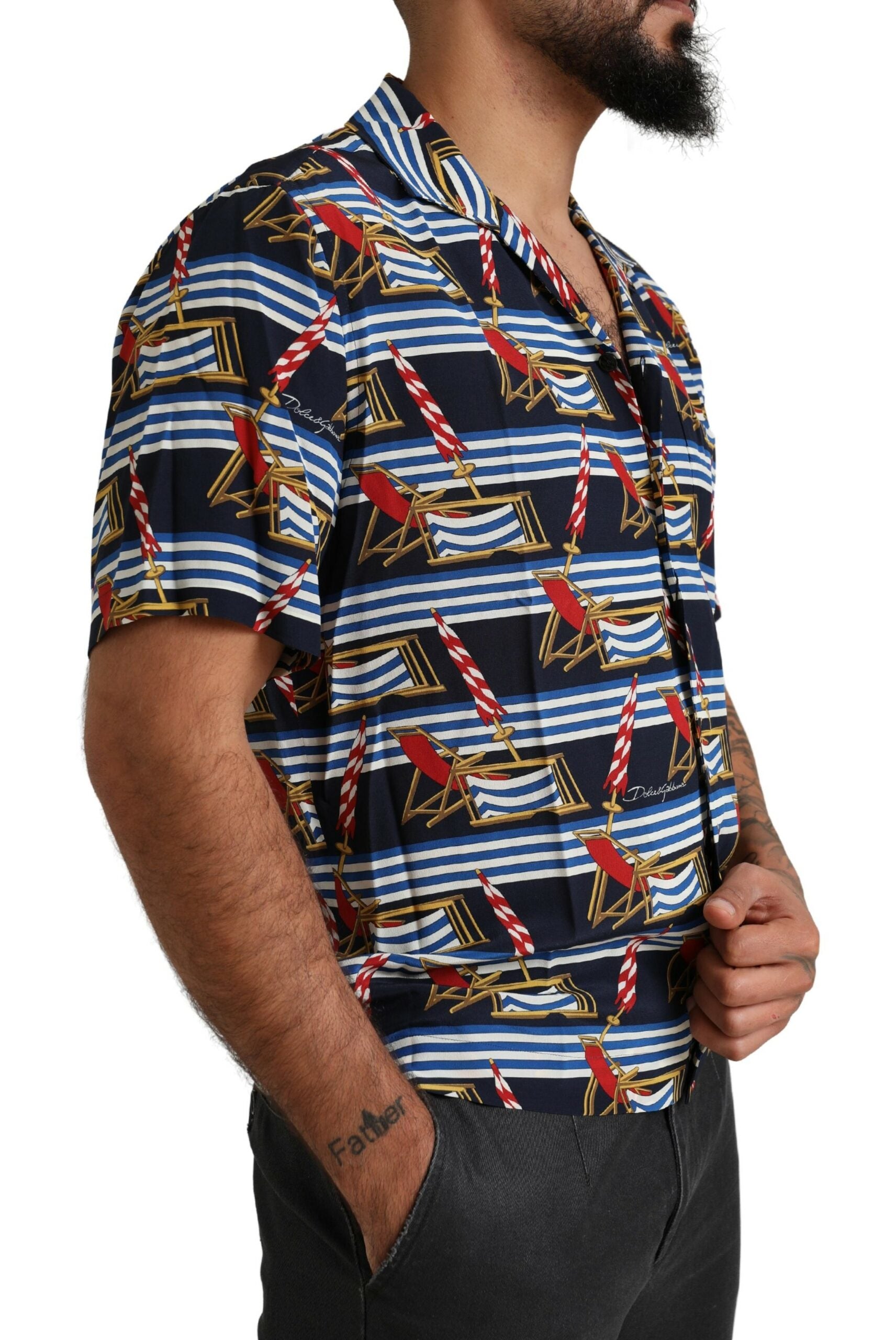 Man wearing a short sleeve shirt with a nautical theme print