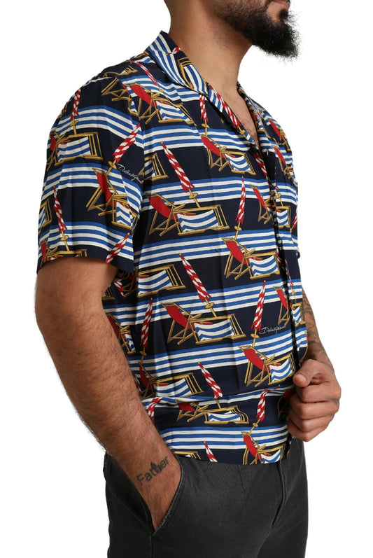 Man wearing a short sleeve shirt with a nautical theme print