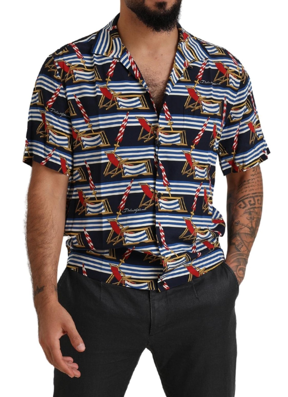 Man wearing a short sleeve shirt with a tropical print