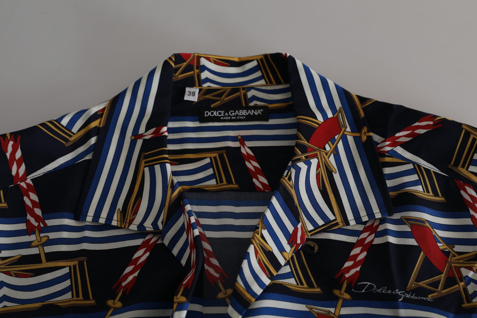 Blue and white striped shirt with red accents