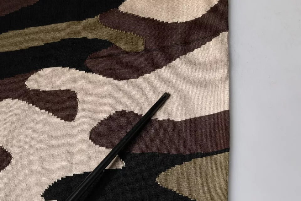 Camouflage fabric with a pen on top