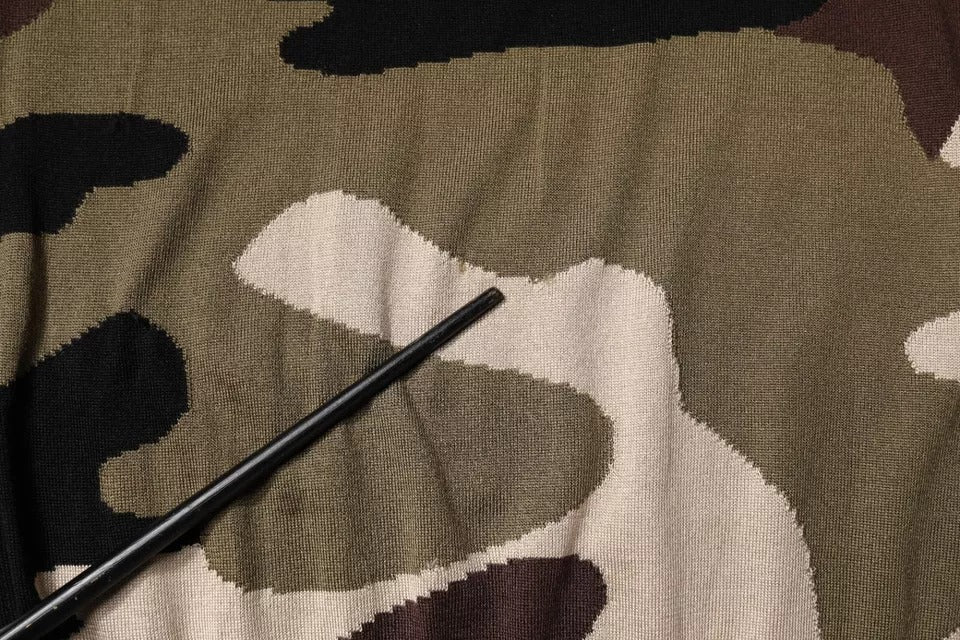 Camouflage fabric with black thread stitching