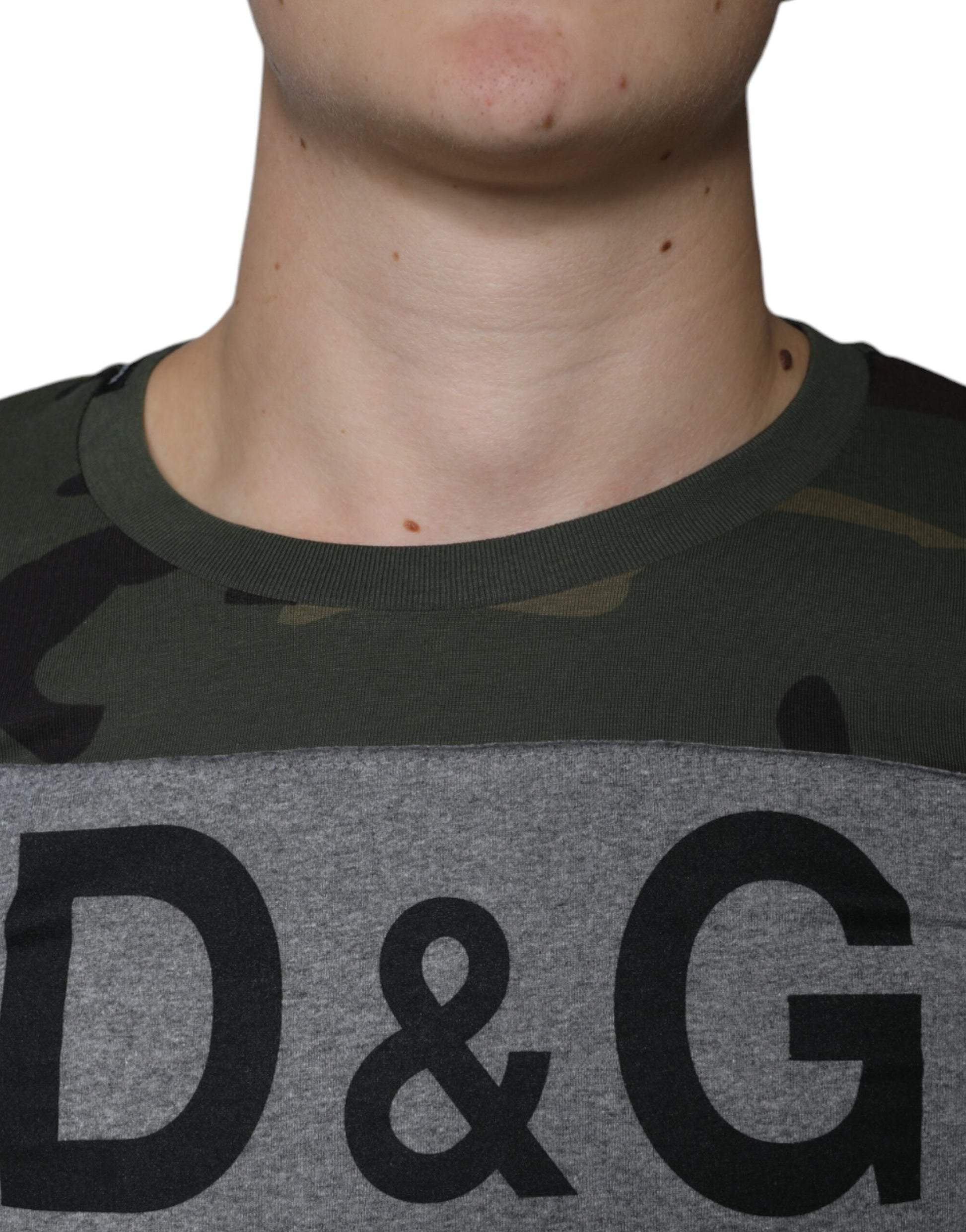 Man wearing camouflage shirt with D&G logo