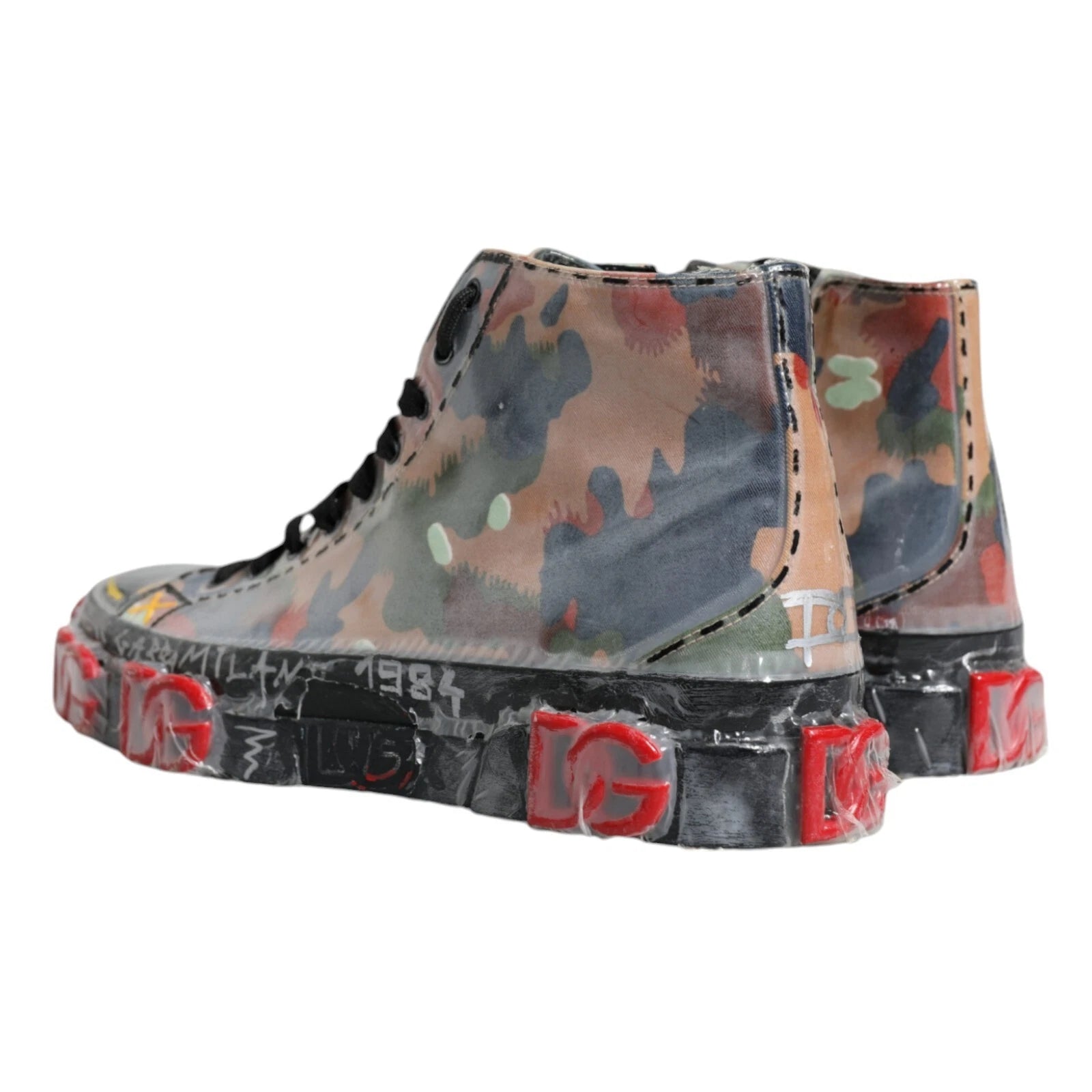 Camouflage patterned boot with red accents