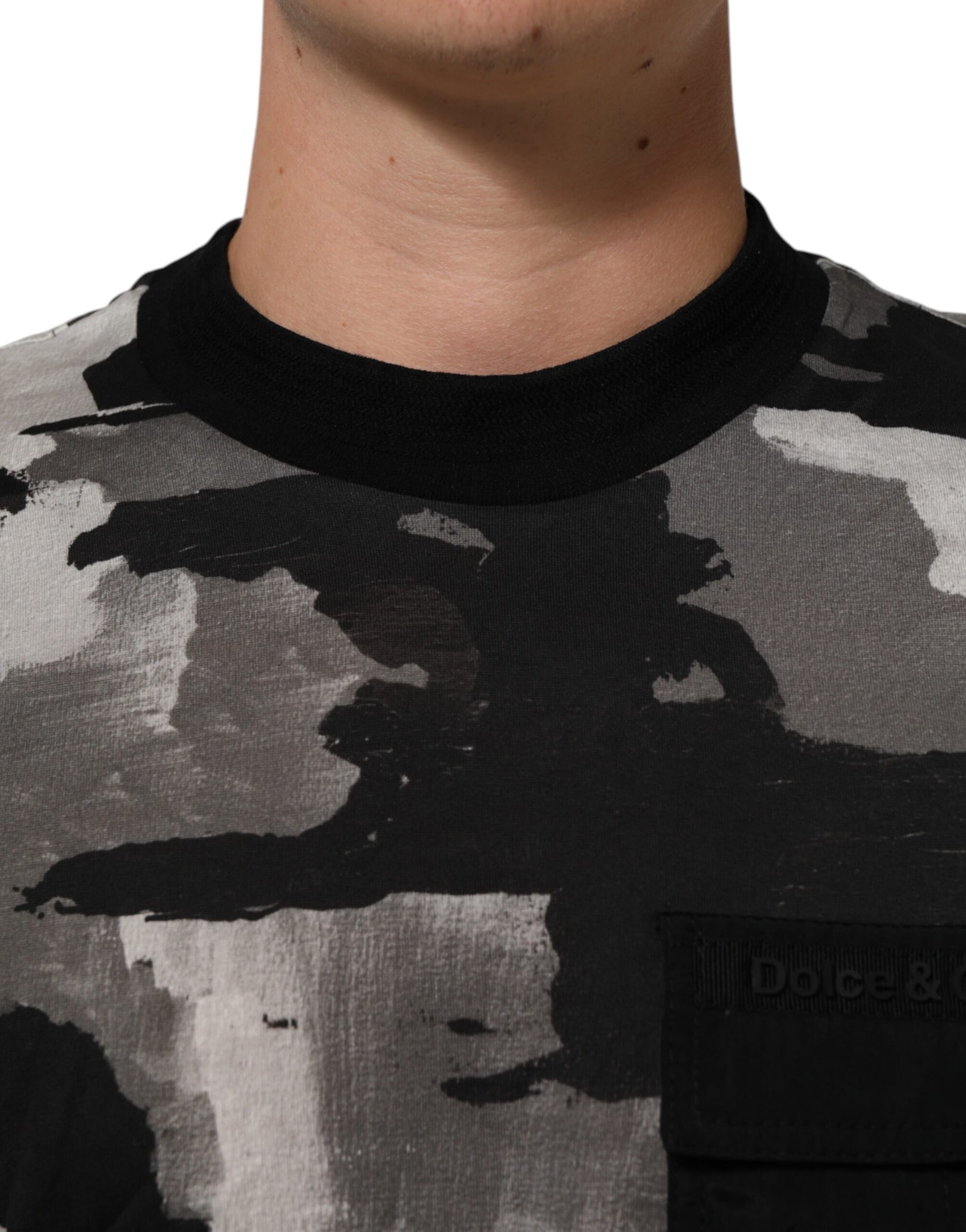Man wearing camouflage shirt with abstract design on front