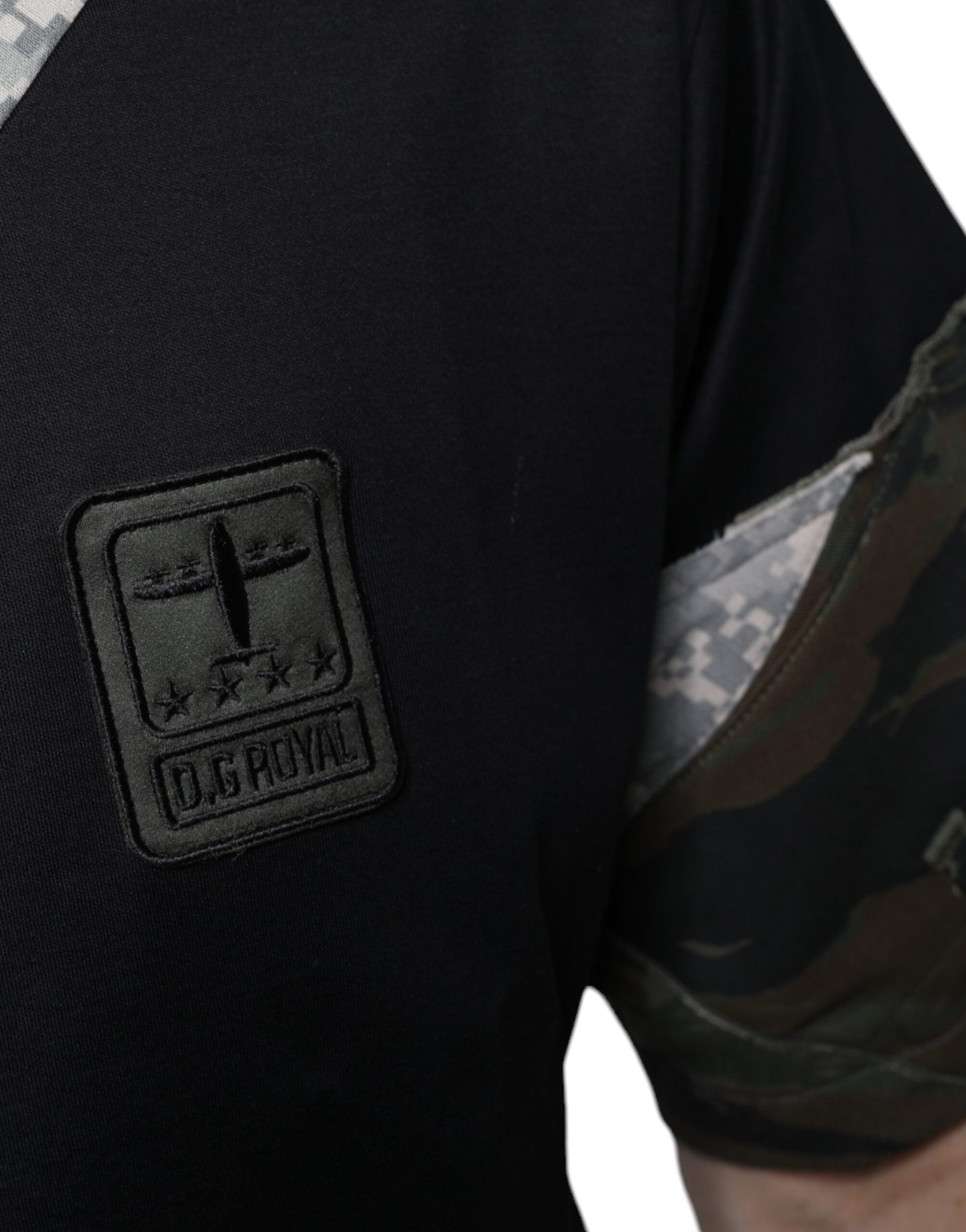 Black shirt with camouflage sleeve featuring a patch