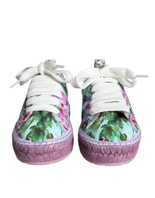 Pair of baby shoes with floral pattern and pink trim