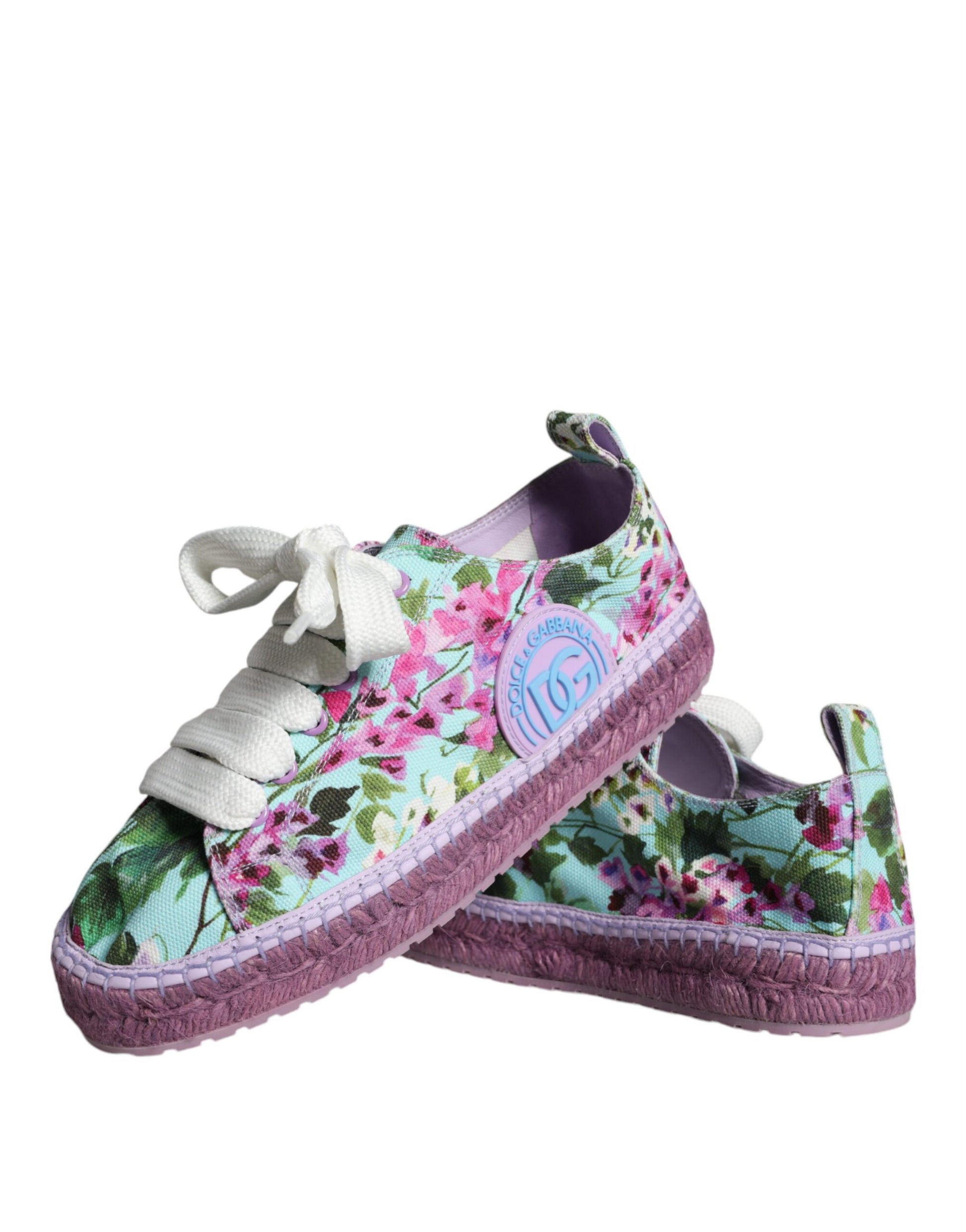 Pair of colorful floral espadrille shoes with laces and a bow
