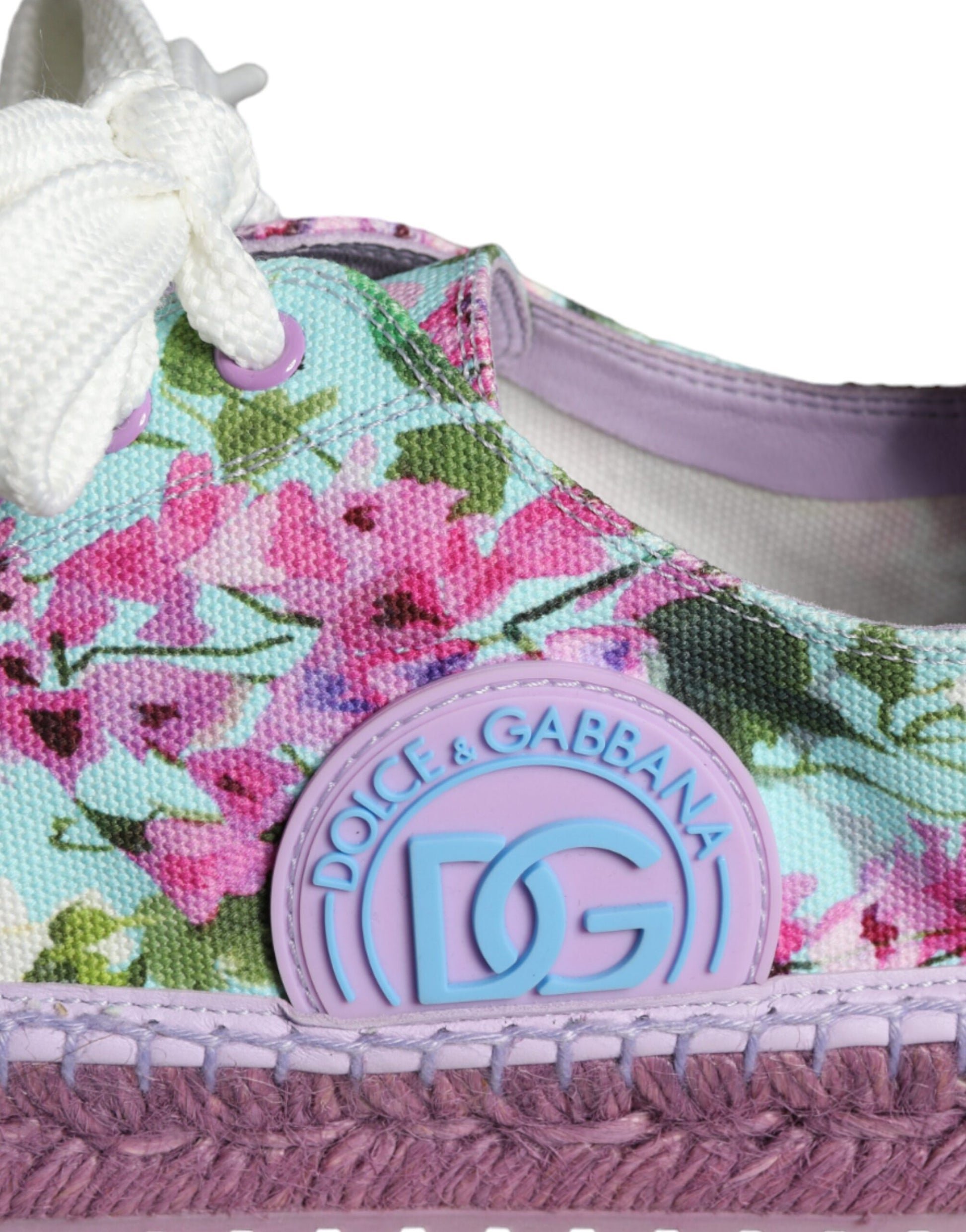 Purple floral sneakers with pink and blue flowers, featuring a purple bow on the side