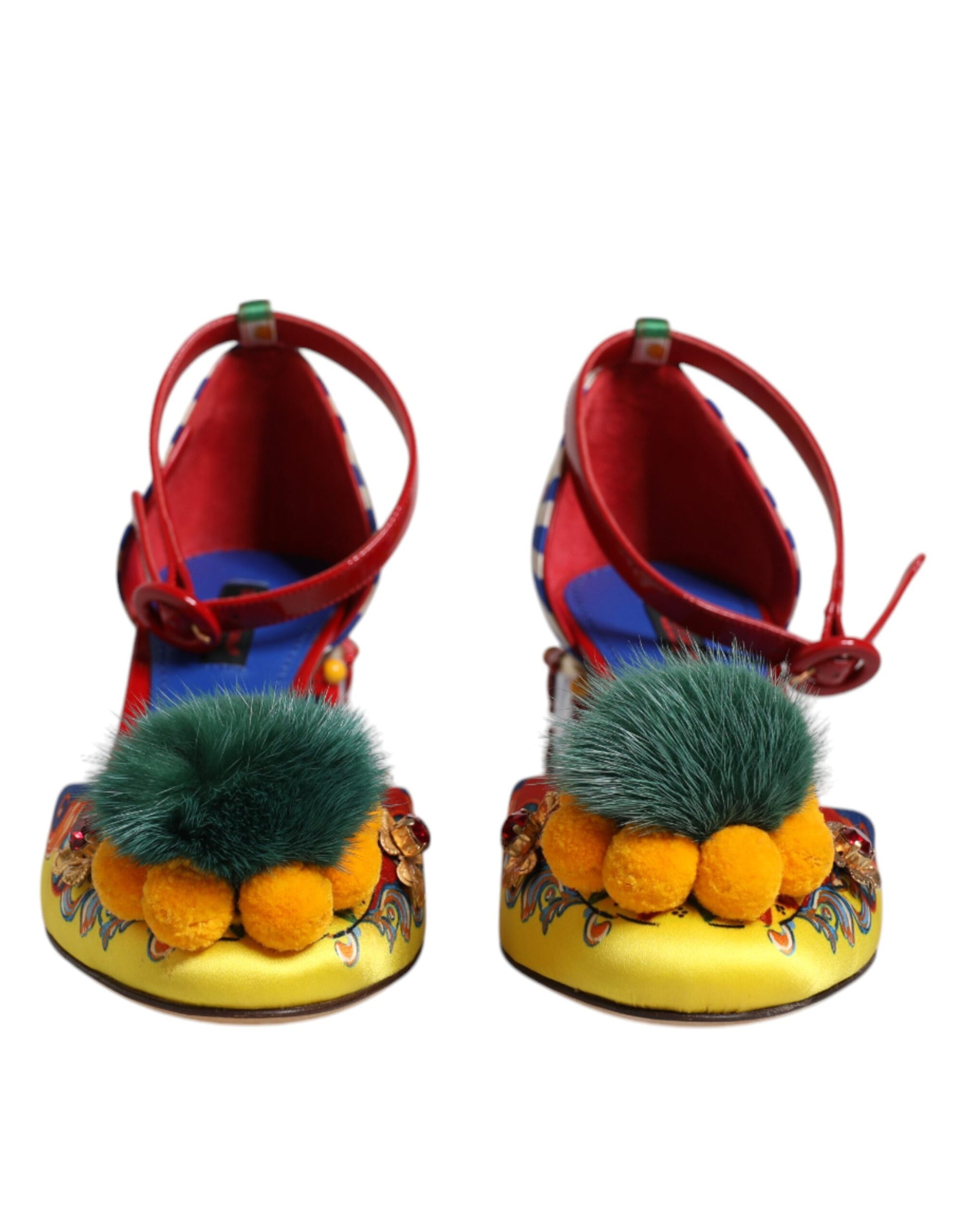 Pair of women's shoes with fur trim and orange pom poms