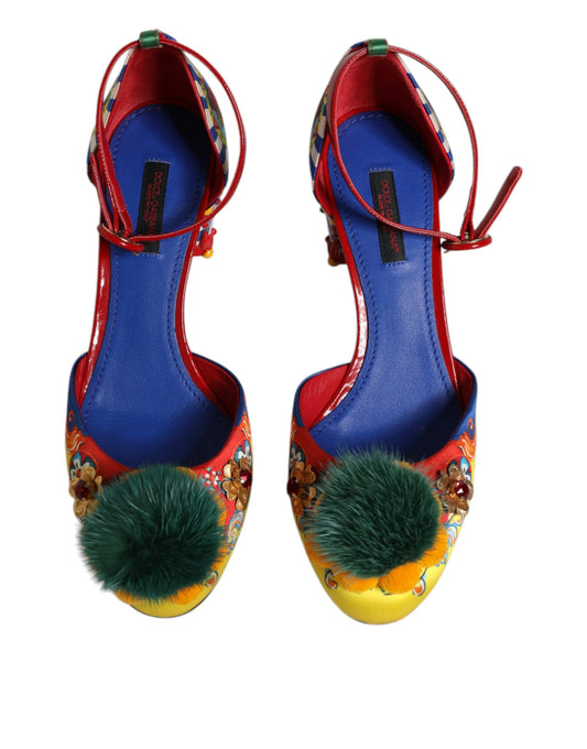 Pair of colorful women's shoes with red laces and fluffy pom poms on heels