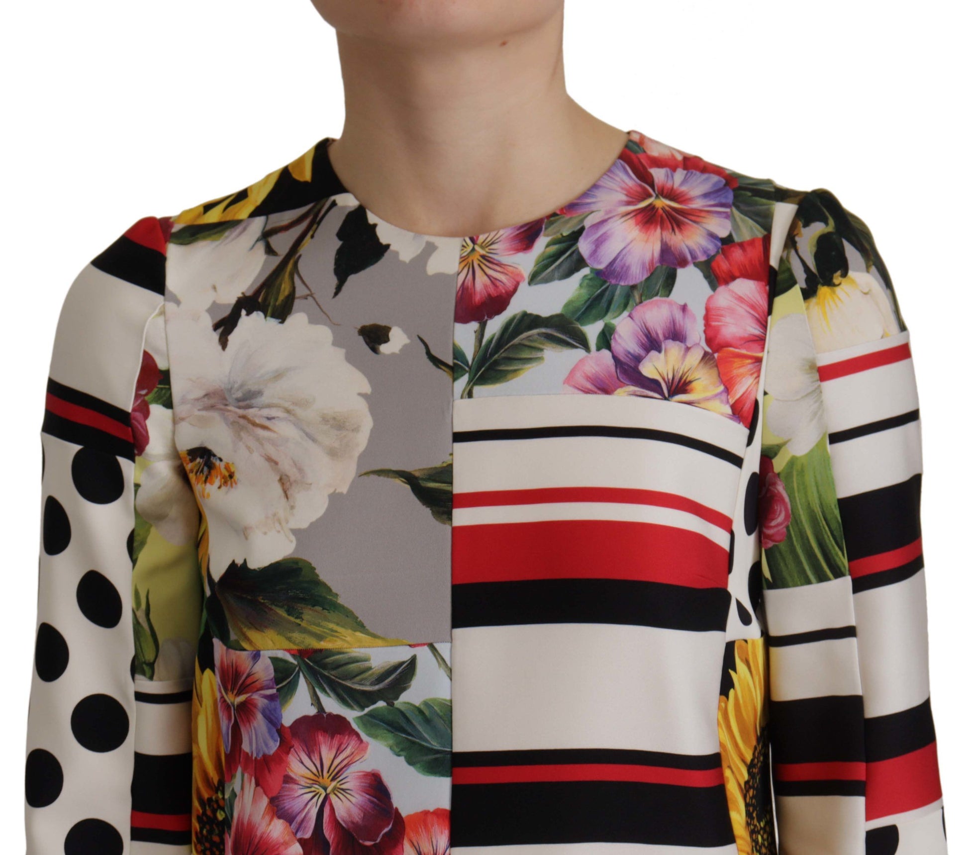 A colorful floral dress with a sheer charmeuse fabric and pachwork design