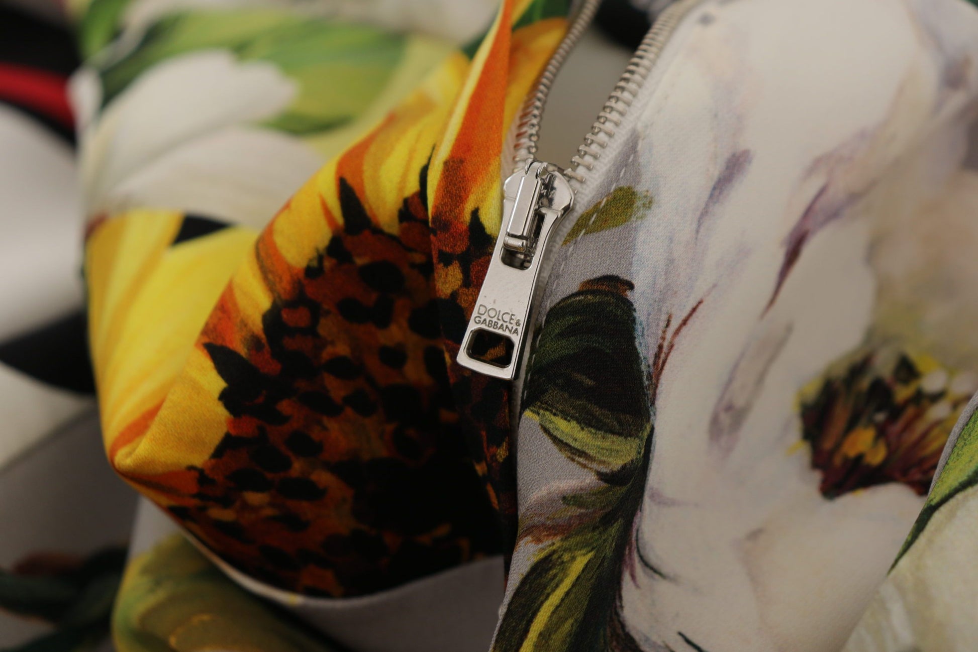 A colorful floral patterned dress with a zipper in the front