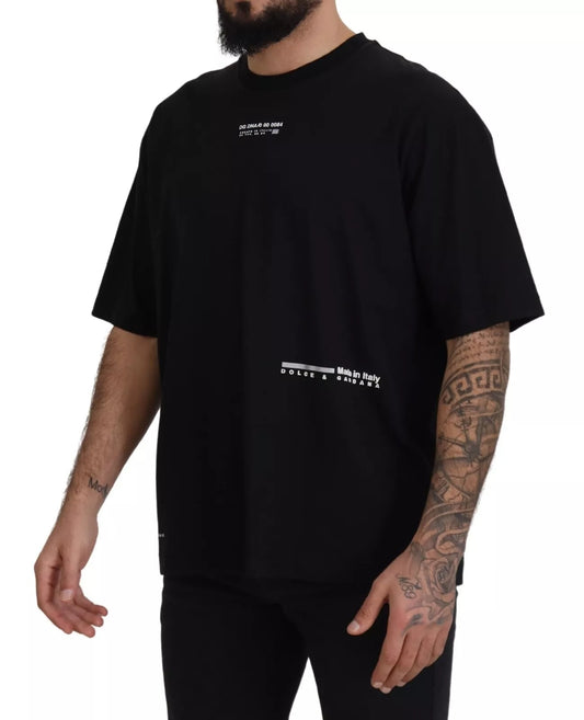 Man wearing black t-shirt with white lettering