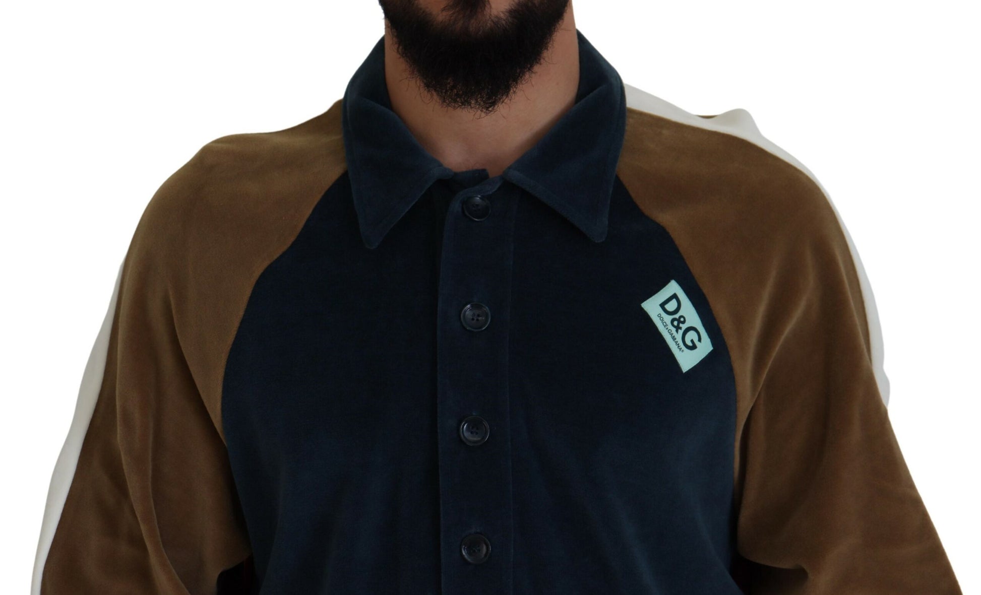 Man wearing dark jacket with tag on chest