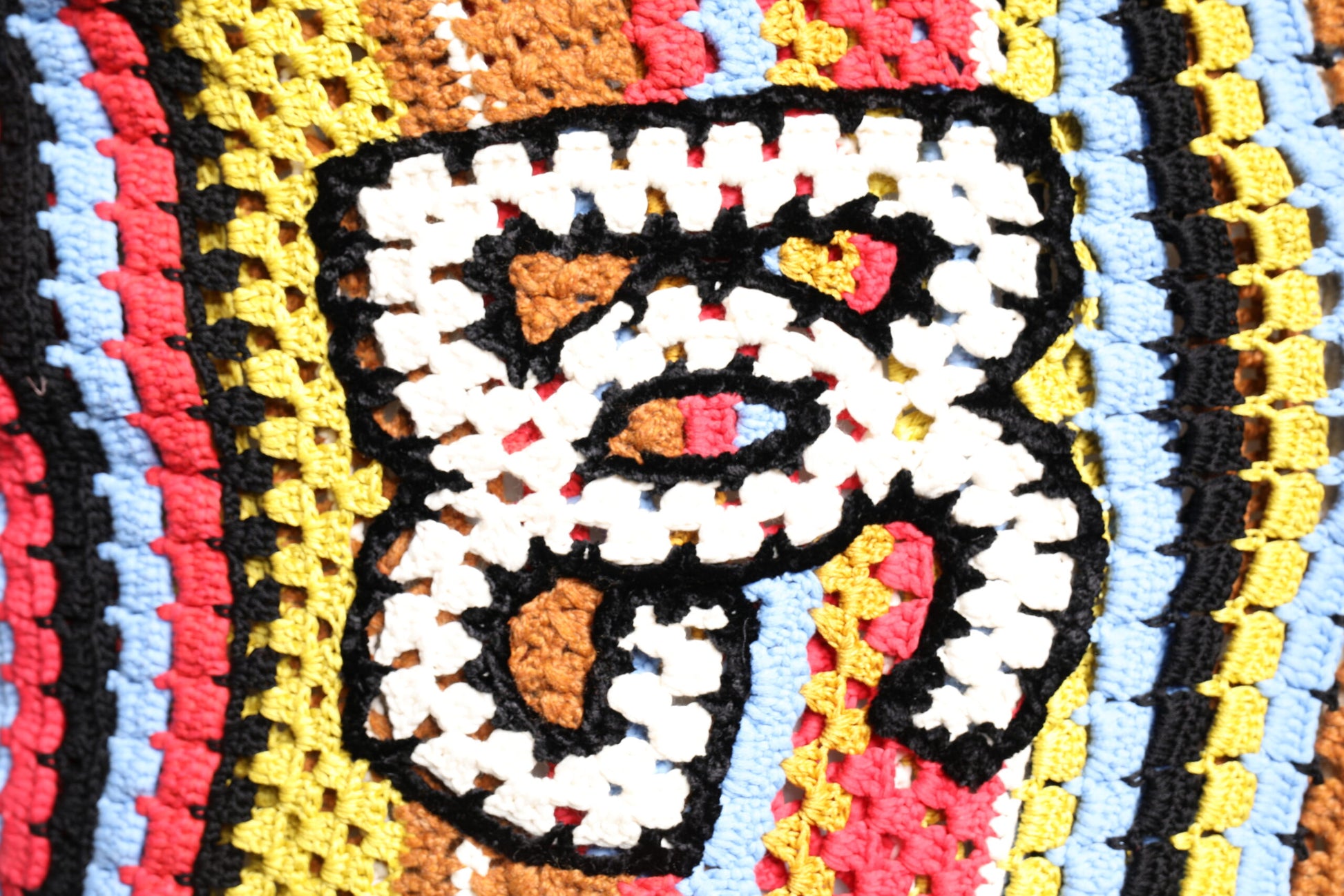 Colorful crocheted belt with letter "B" design
