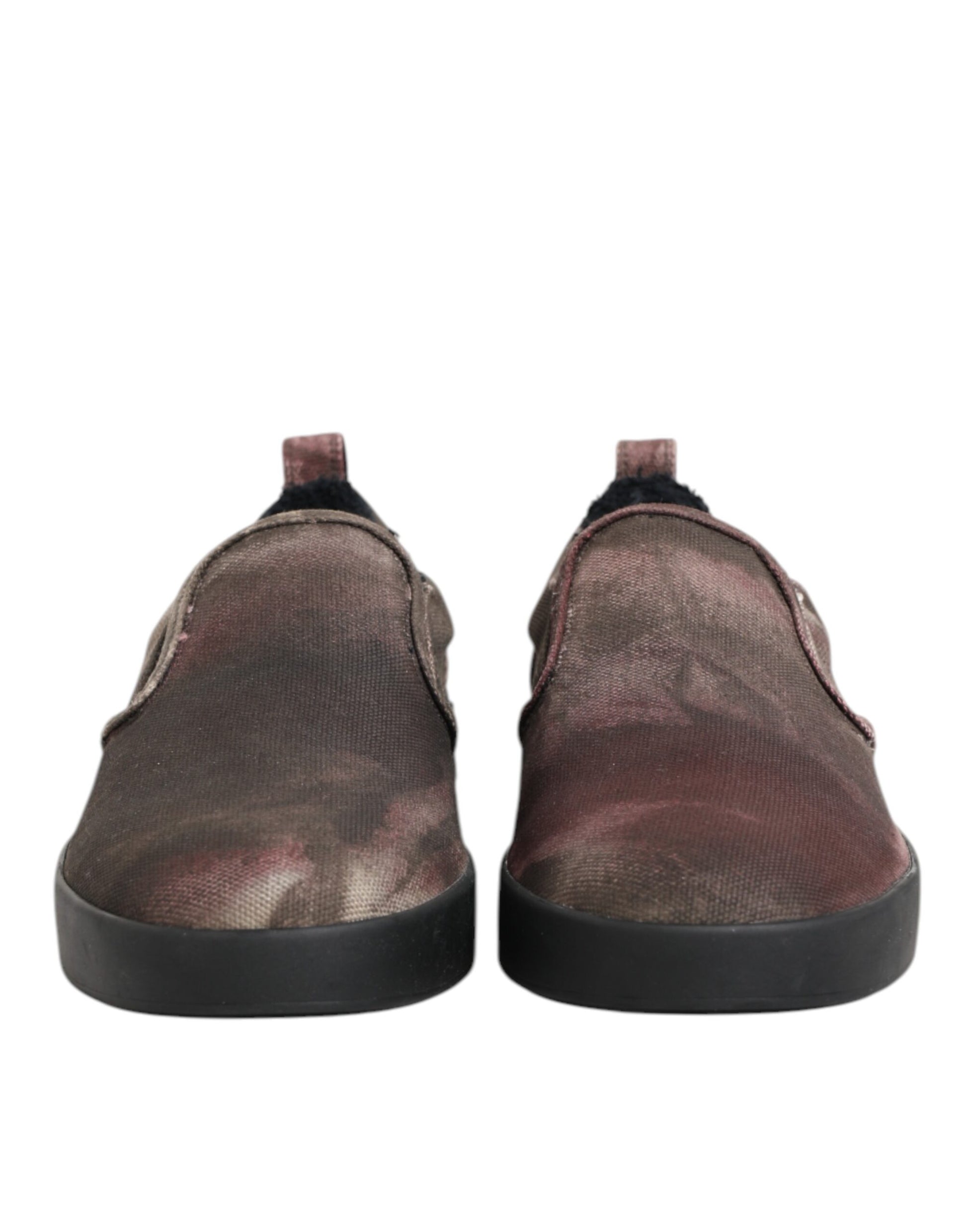 Pair of shoes with black soles and a camouflage pattern on the upper part