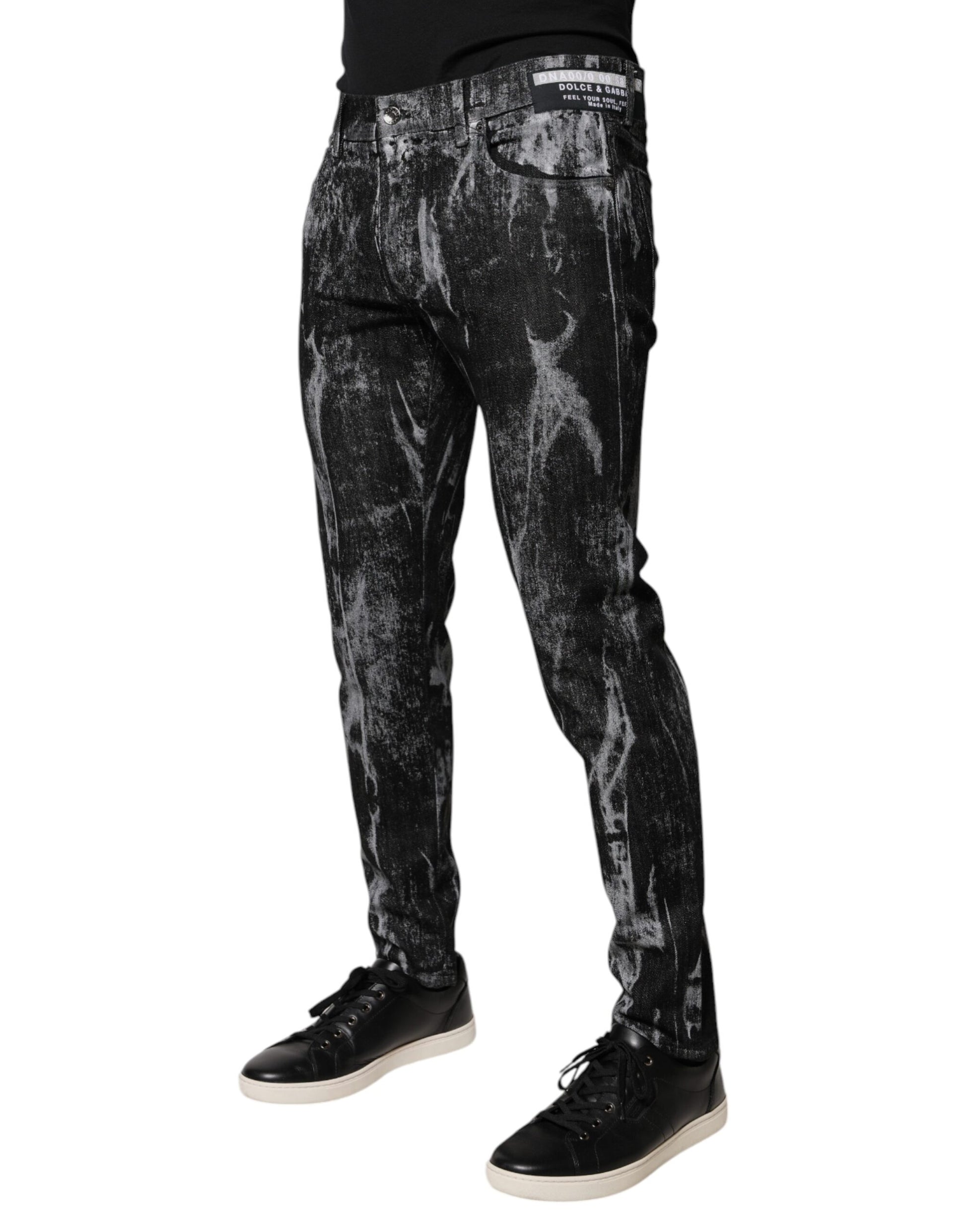 Man wearing black jeans with white paint splatters