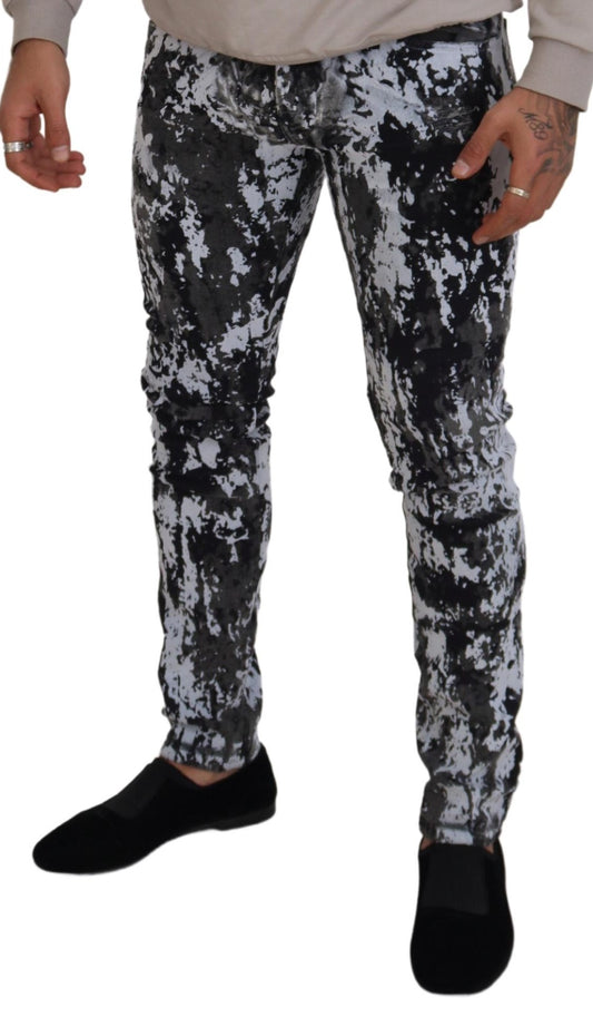 Man wearing camouflage pants and black shoes