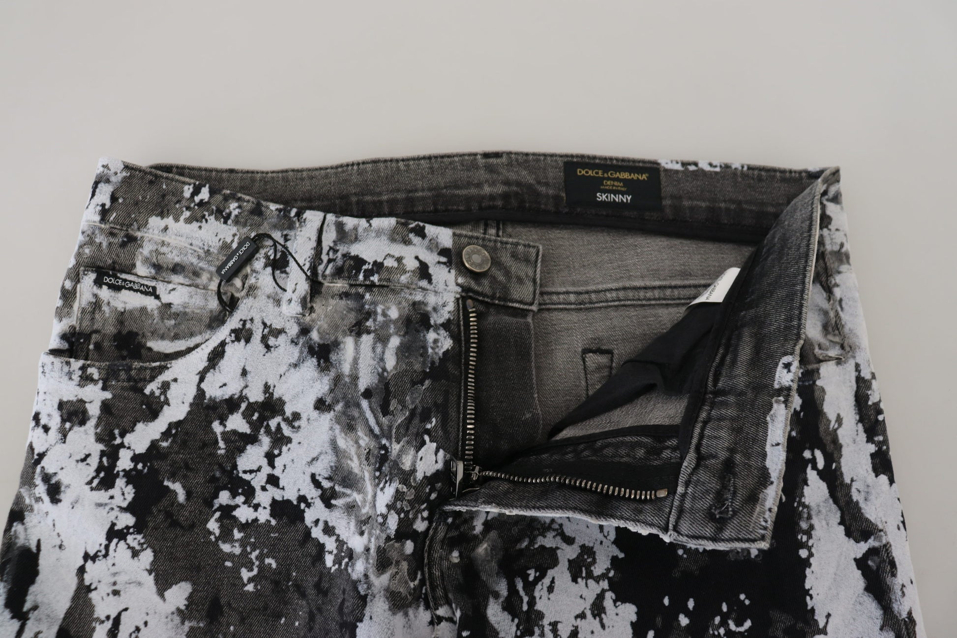 Pair of distressed jeans with floral pattern