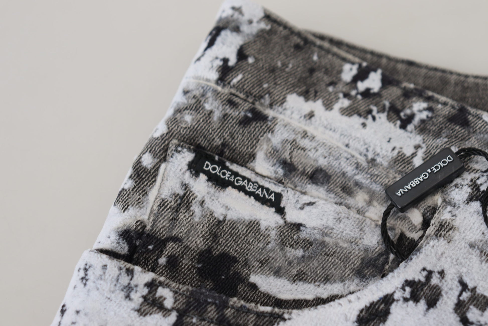 Black and white tie dye t-shirt with a tag on the neckline