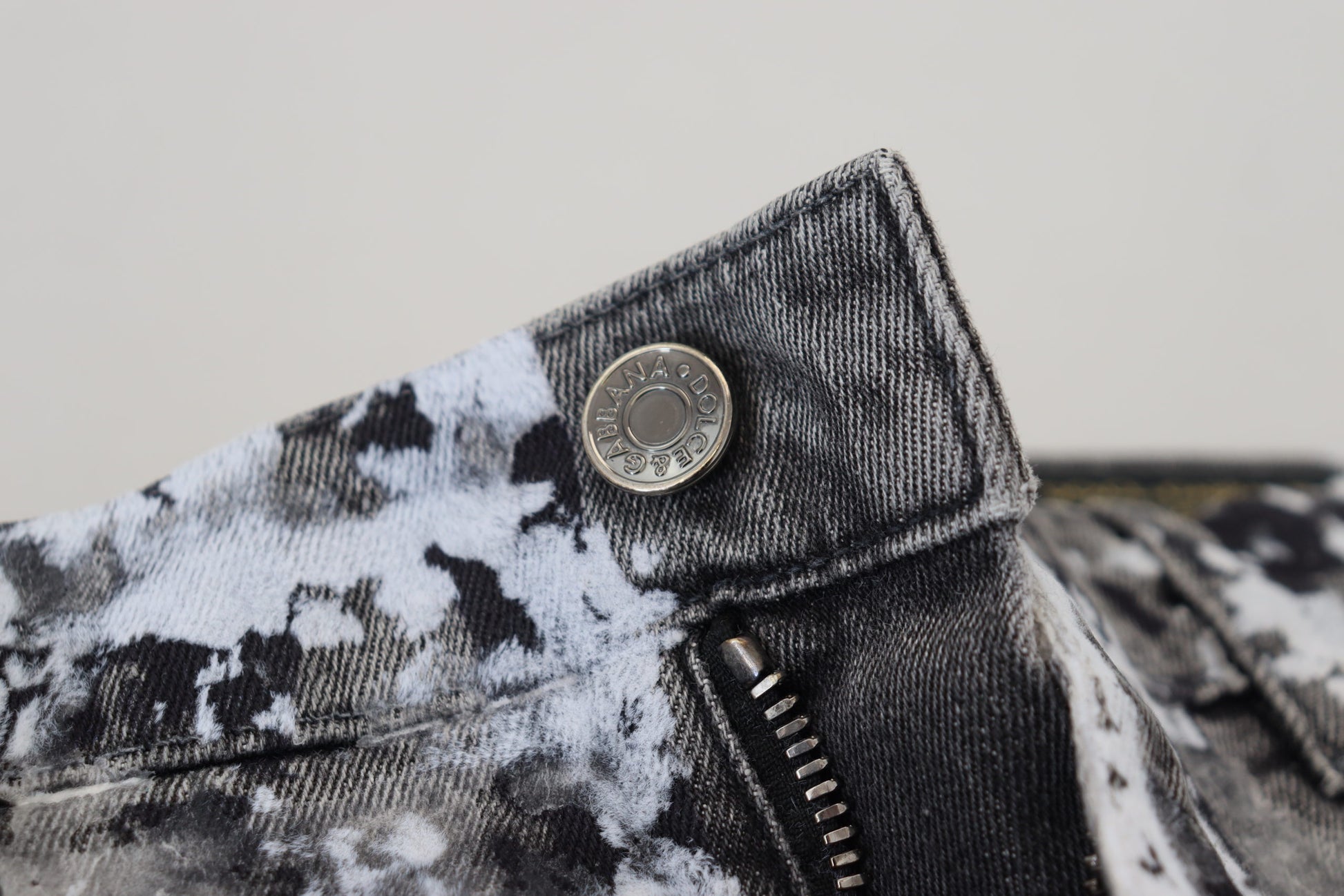 Denim jeans with a button closure