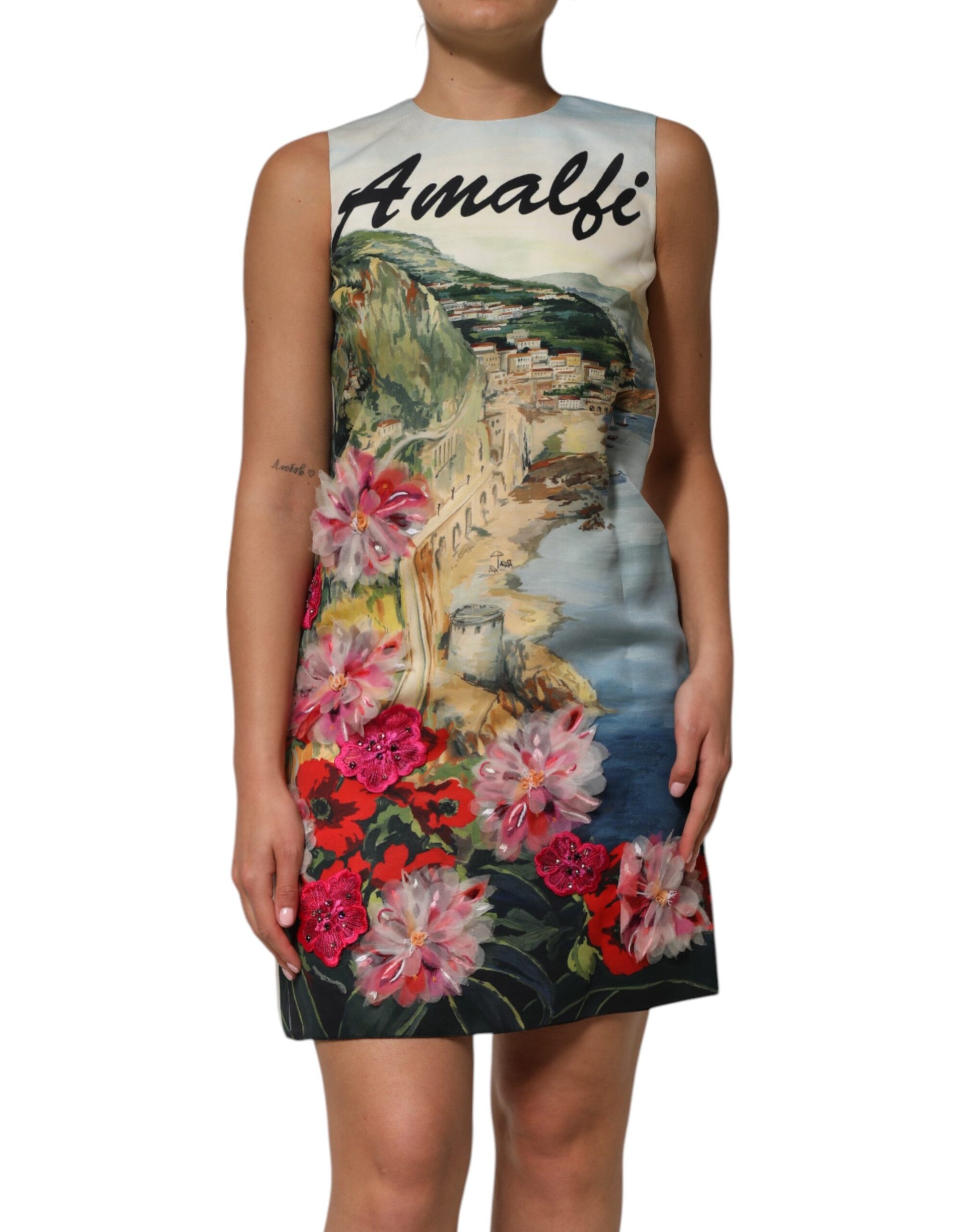 A multicolored dress with crystal embellishments and a floral print on the front