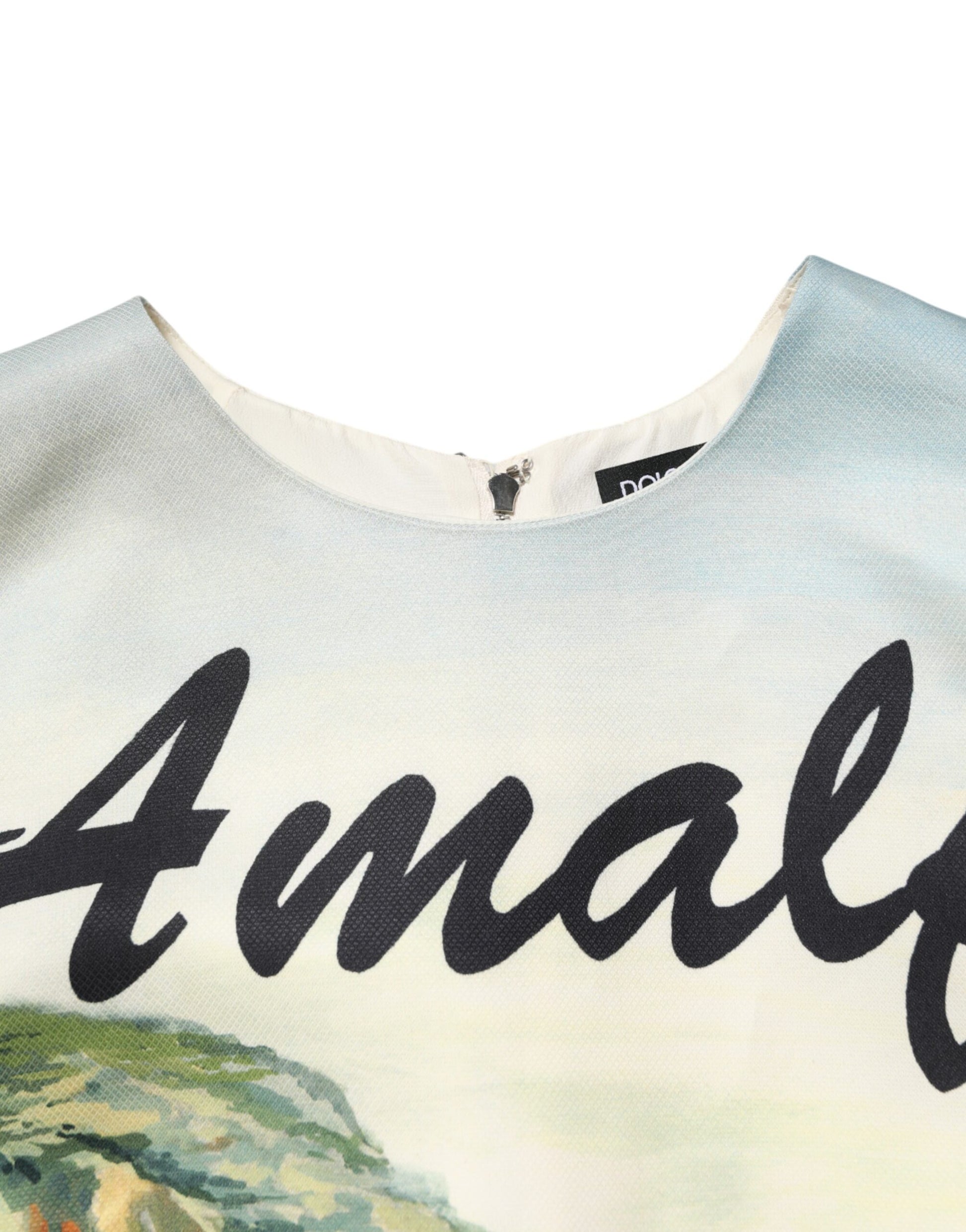 A multicolored dress with crystal embellishments and a graphic print of the word "Amalia" on the front