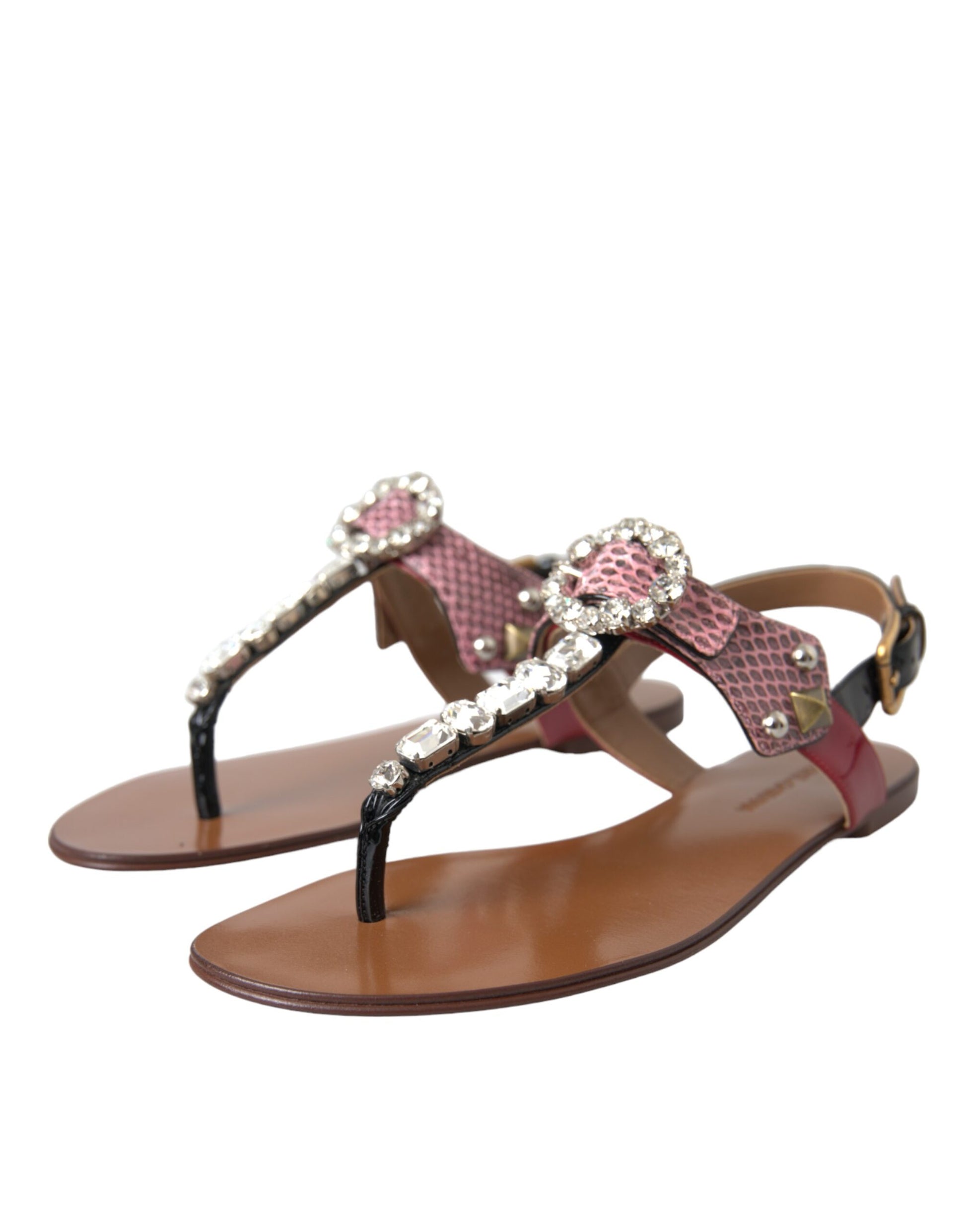 Pair of brown sandals with pink and white accents