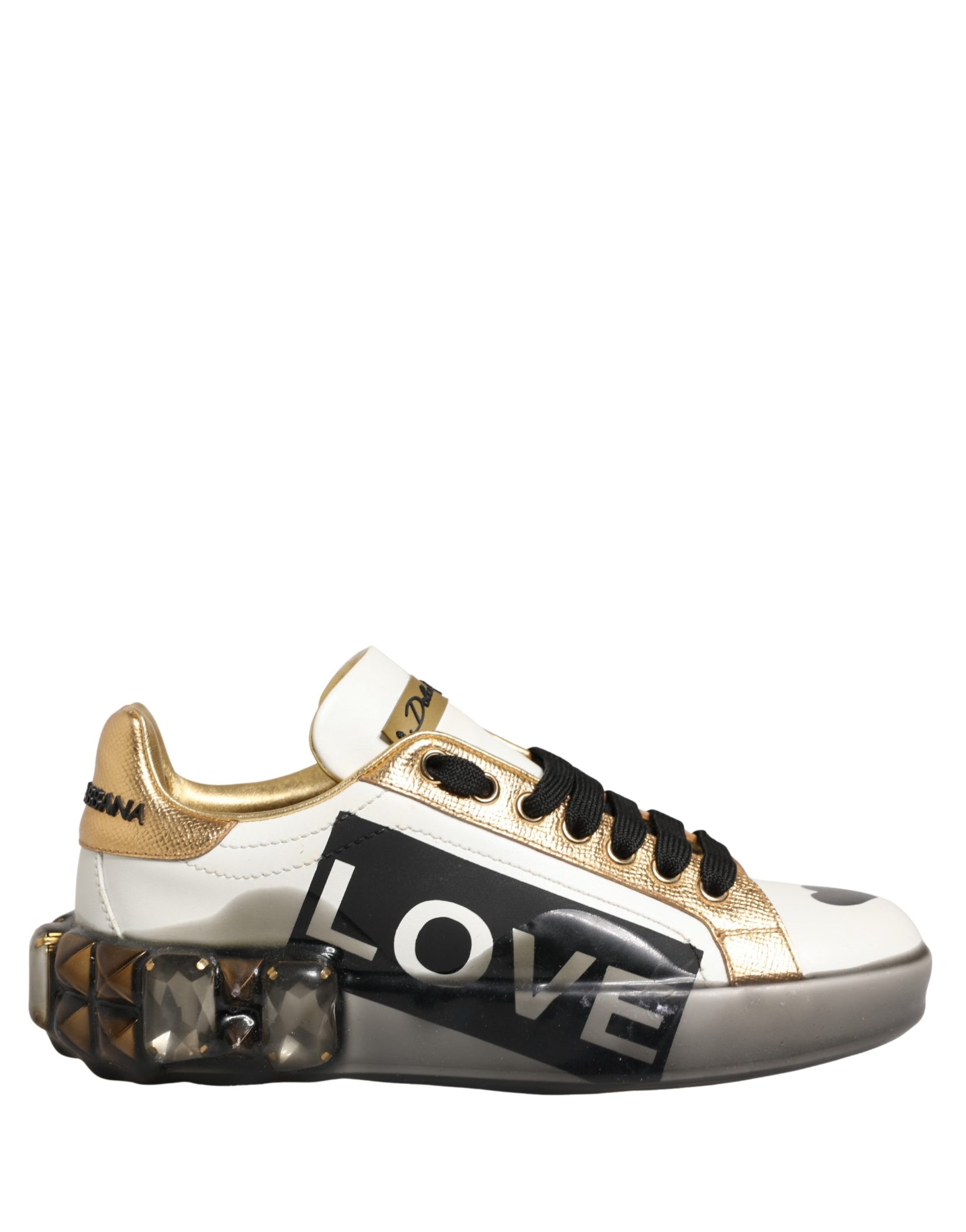 Gold and white sneakers with crystals, featuring the word "love" in bold letters