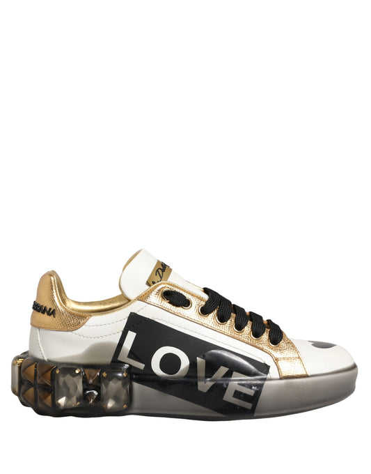 Gold and white sneakers with crystals, featuring the word "love" in bold letters