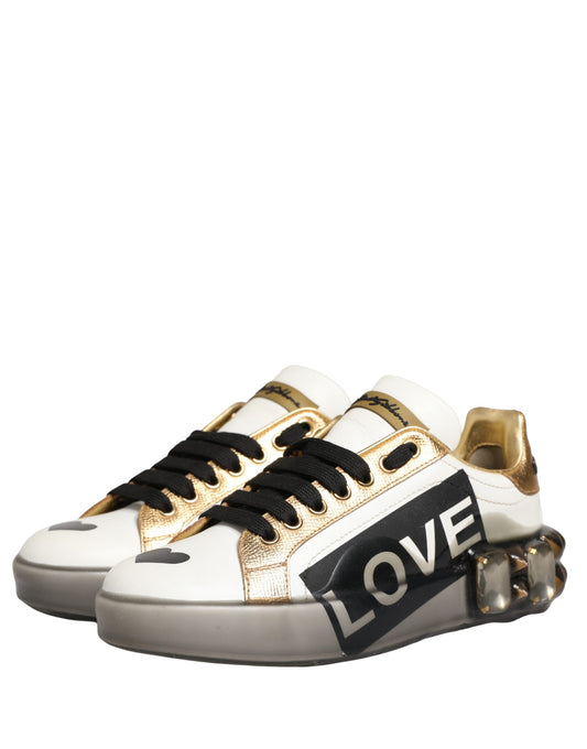 Gold and white sneakers with "love" written on side, featuring crystal studs