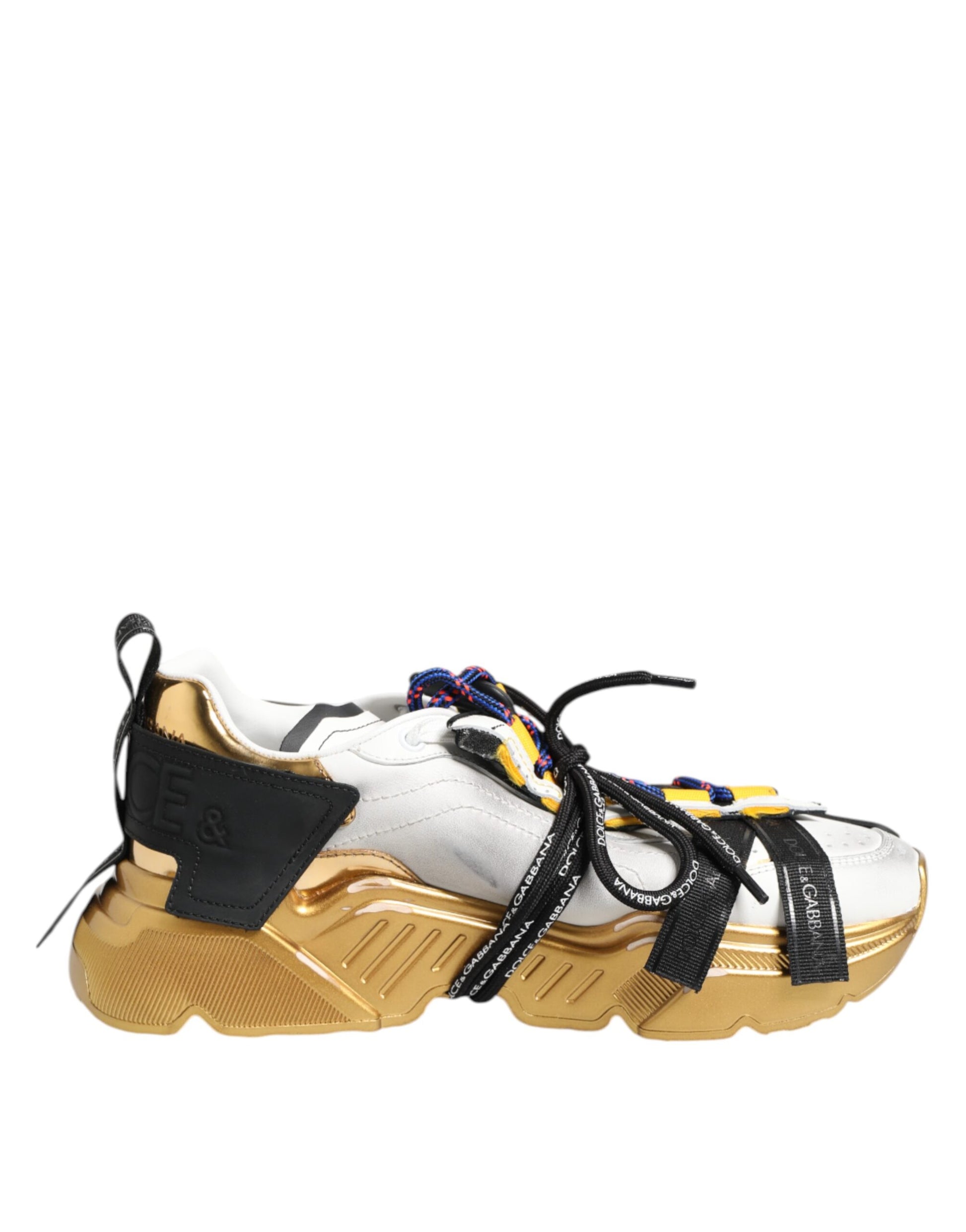 Gold and white sneaker with black laces
