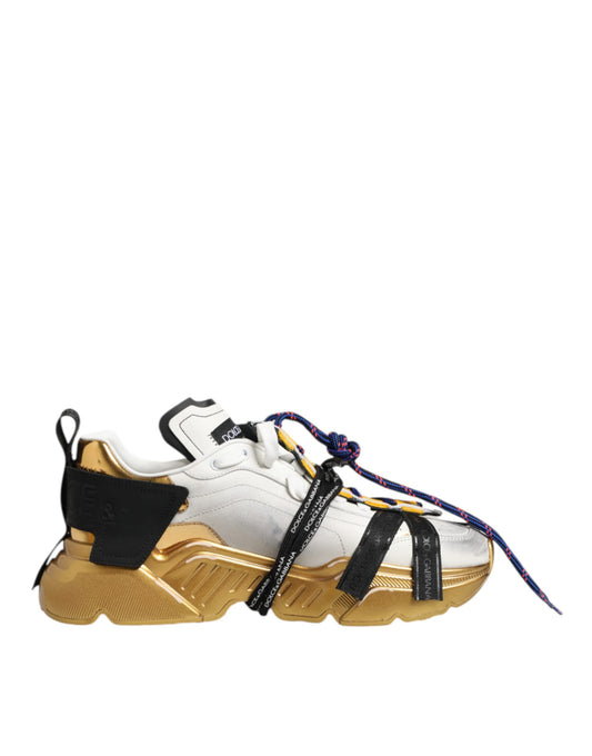 Gold and white sneakers with black straps, laces, and soles
